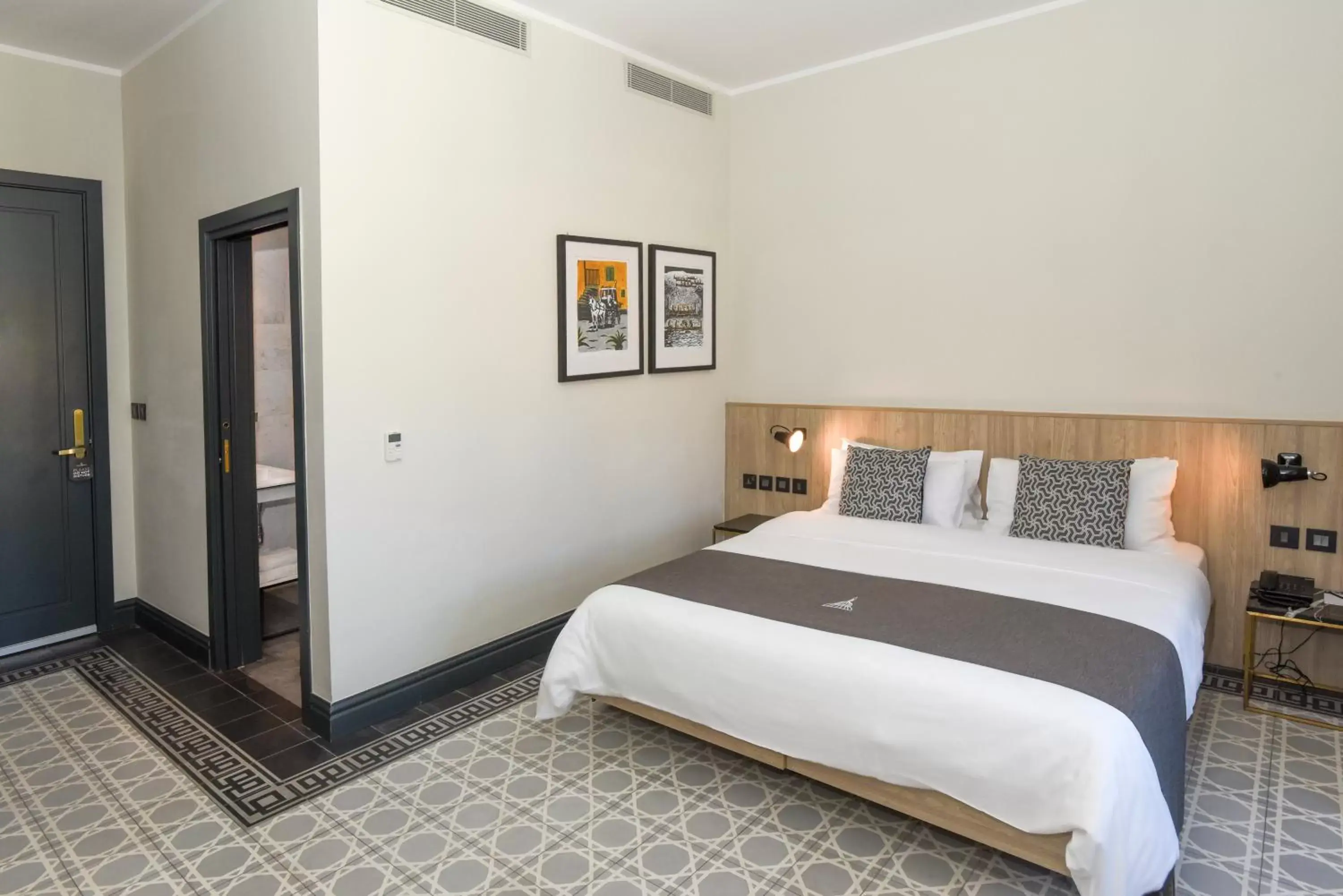 Bed in La Falconeria Hotel