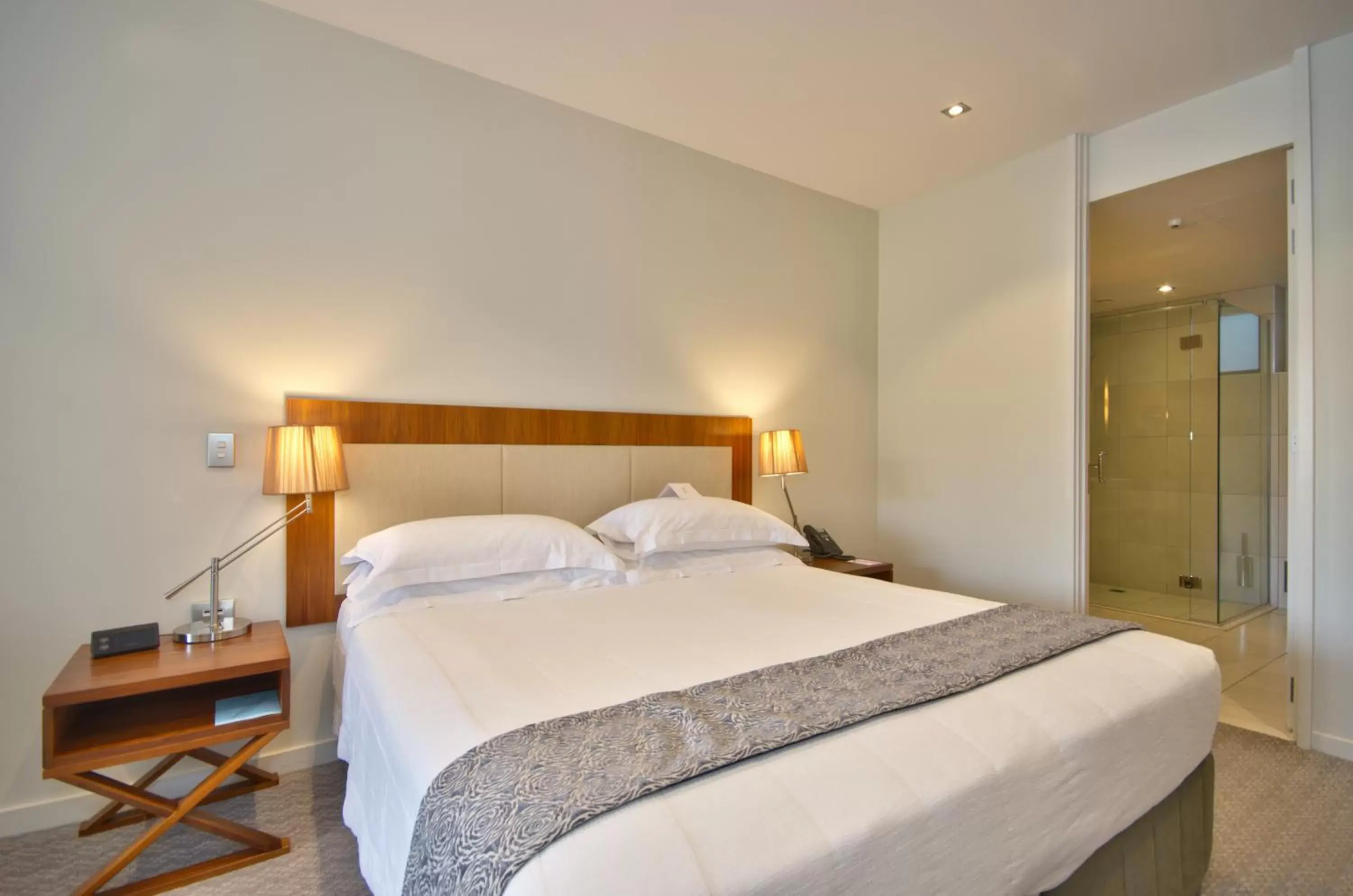 Bed in The Rees Hotel & Luxury Apartments