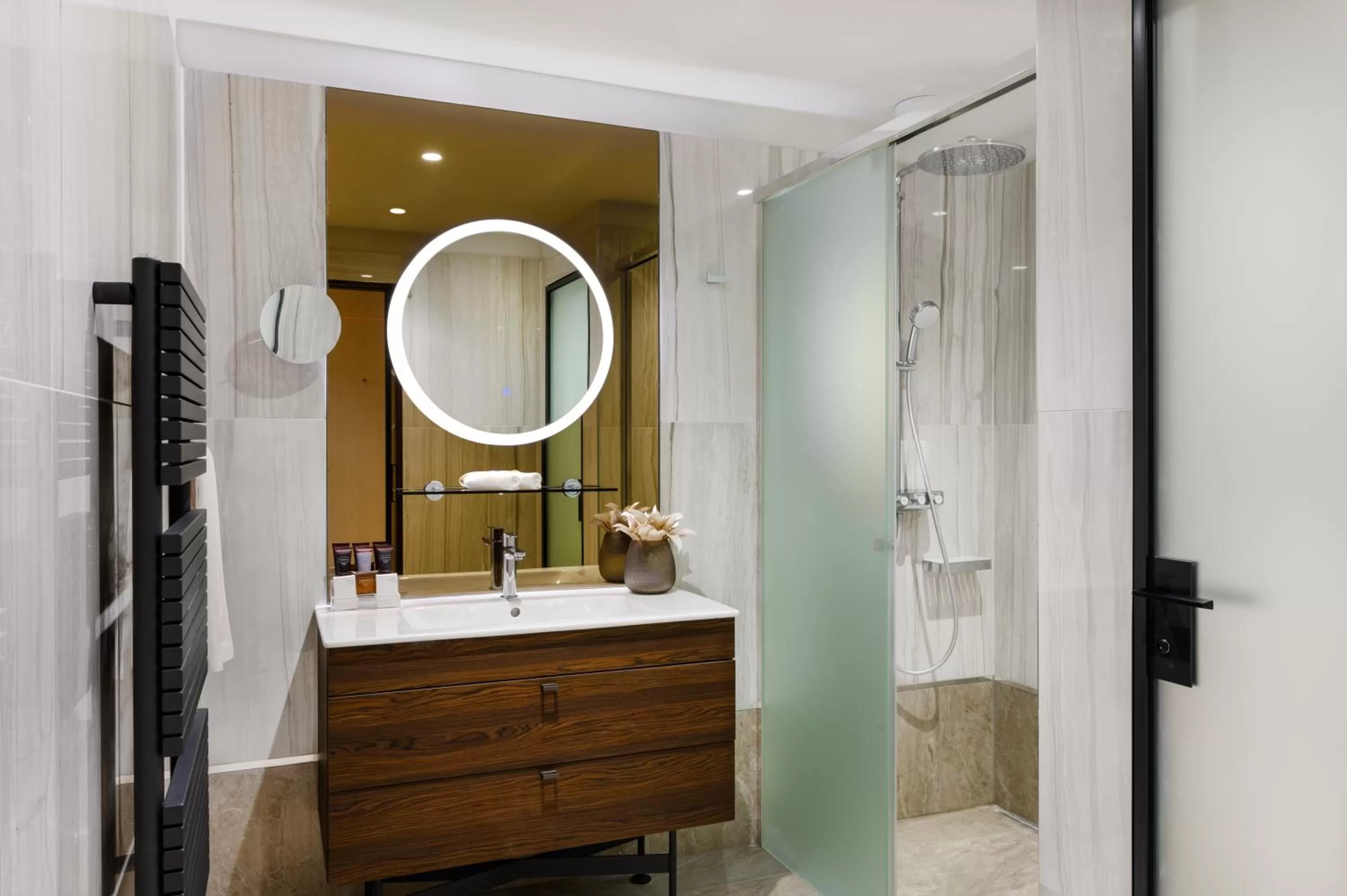 Bathroom in Emerald Downtown Luxury Suites by Continental Group