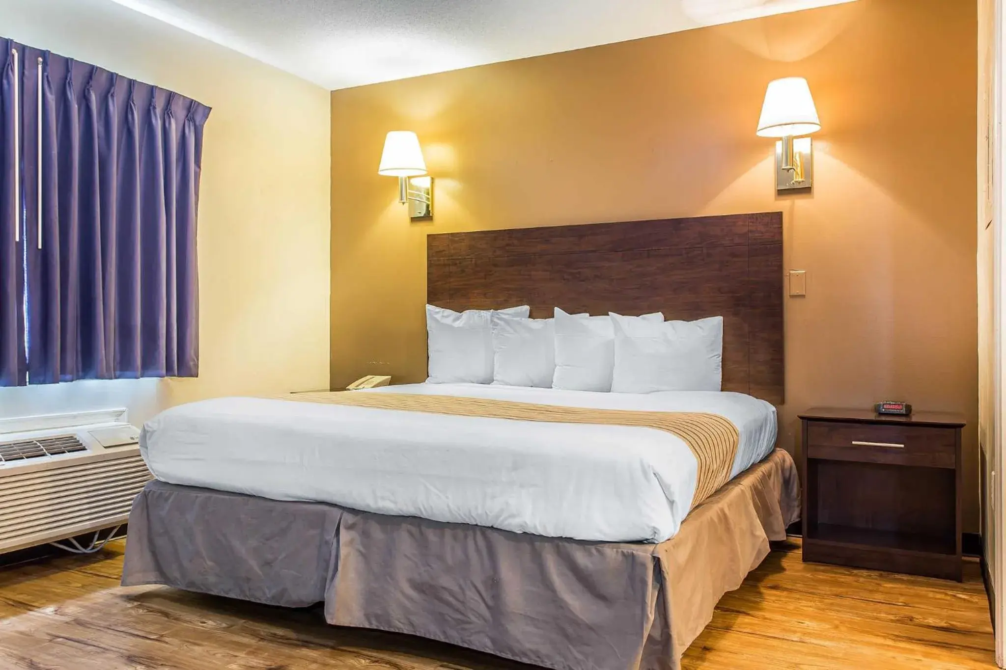 Photo of the whole room, Bed in Suburban Studios near University of North Carolina-Charlotte Photo of the whole room, Bed in Suburban Studios near University of North Carolina-Charlotte