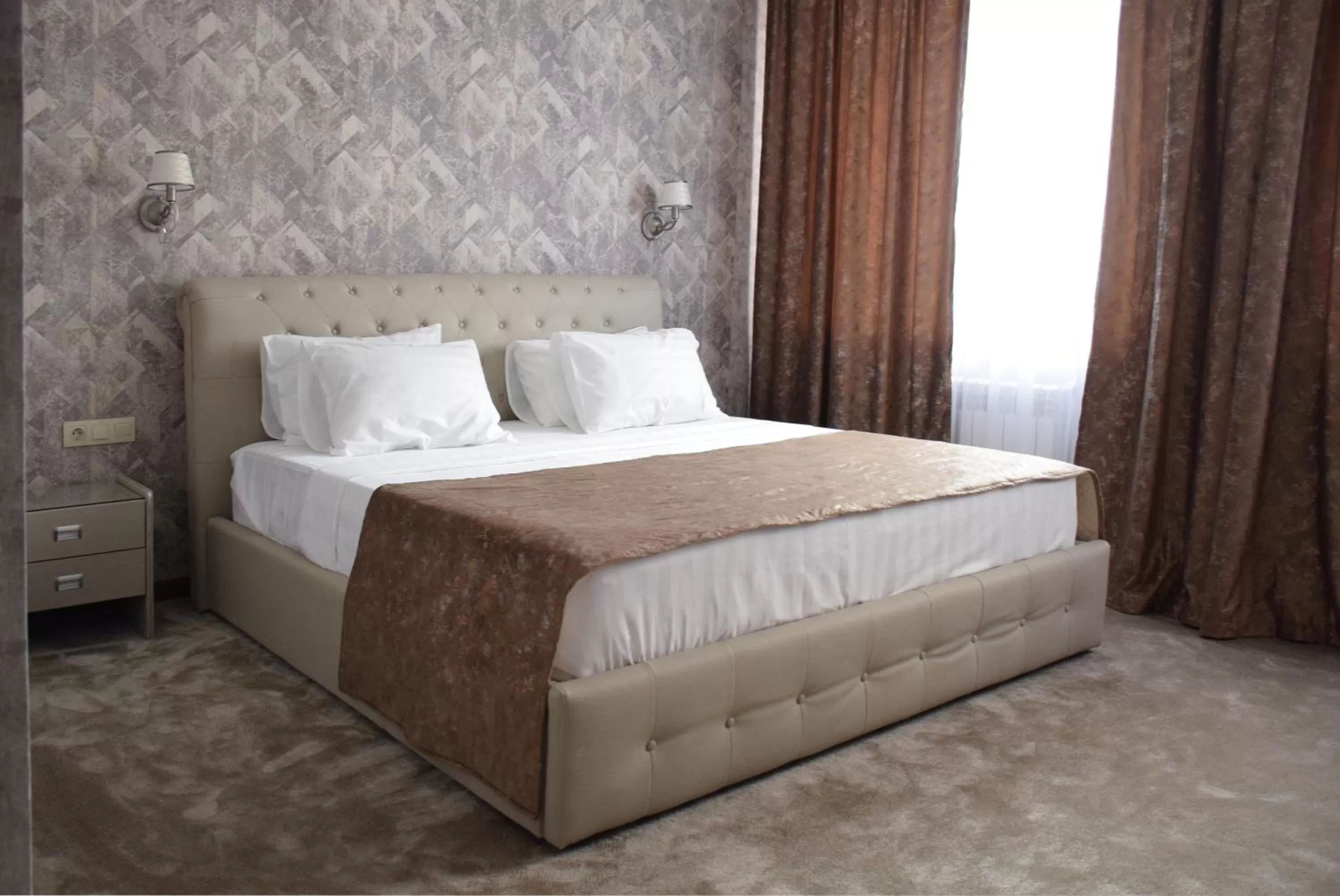 Bed in MirOtel Hotel