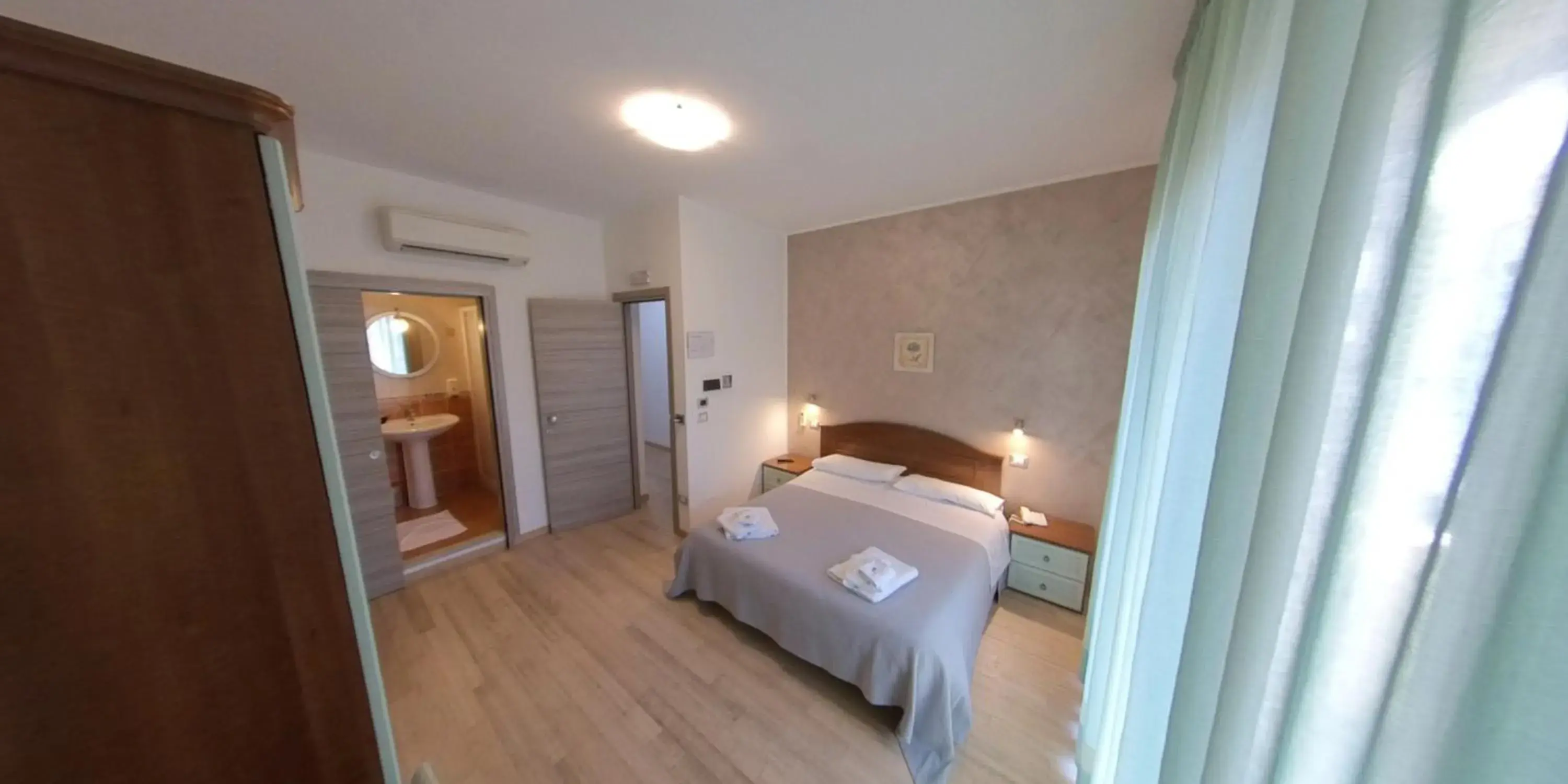 Bed in Albergo Perseo