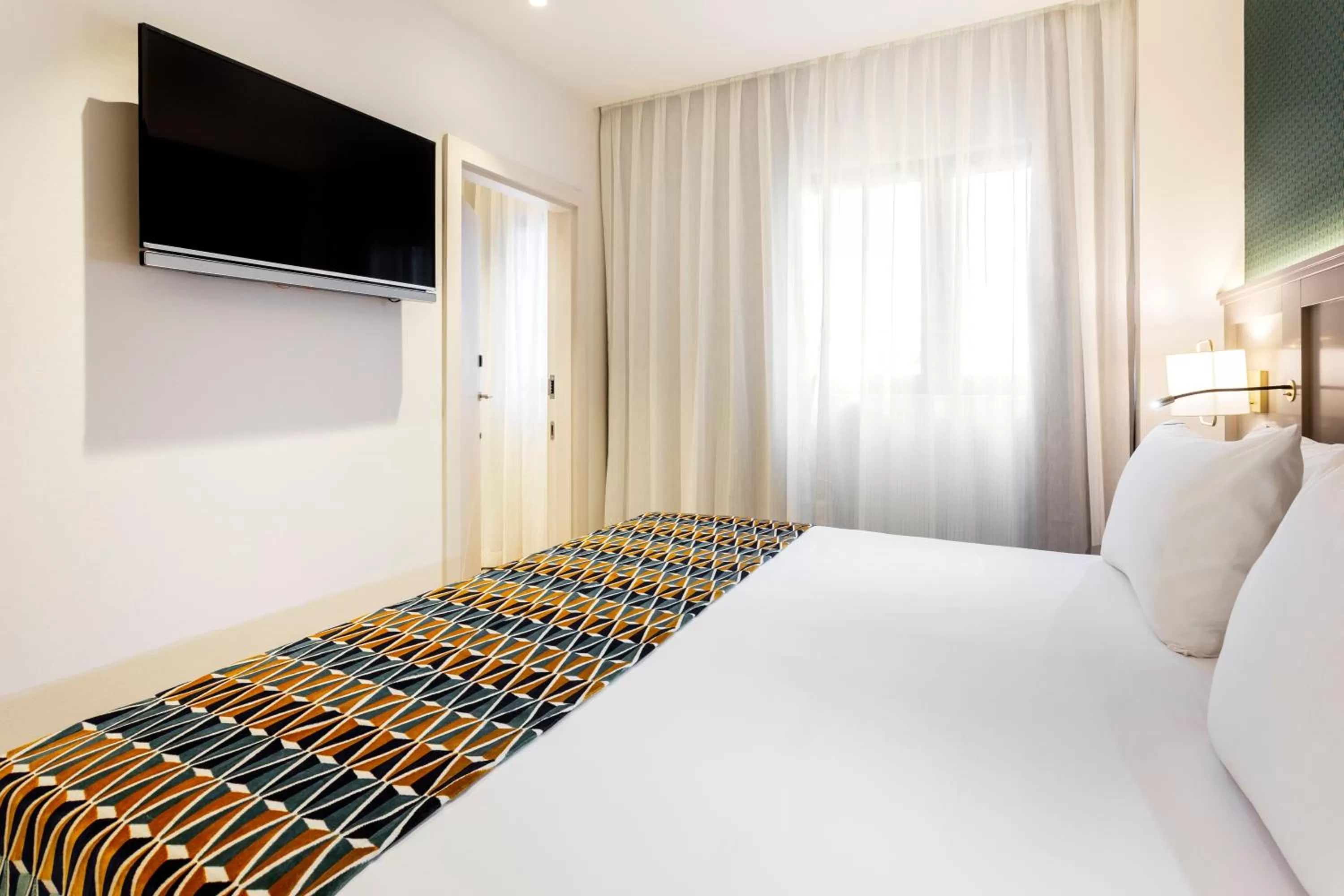 Photo of the whole room, Bed in Eurostars Puerta Real