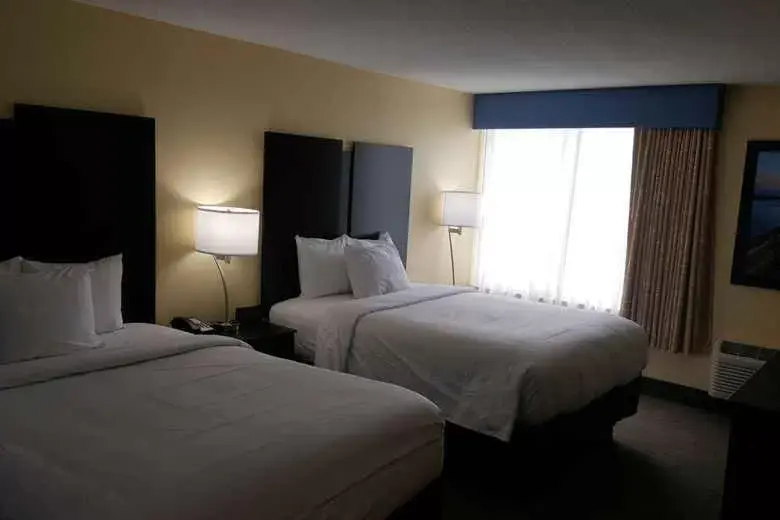Bed in Days Inn & Suites by Wyndham Grand Rapids Near Downtown