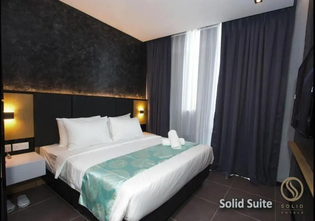Bed in Solid Hotels