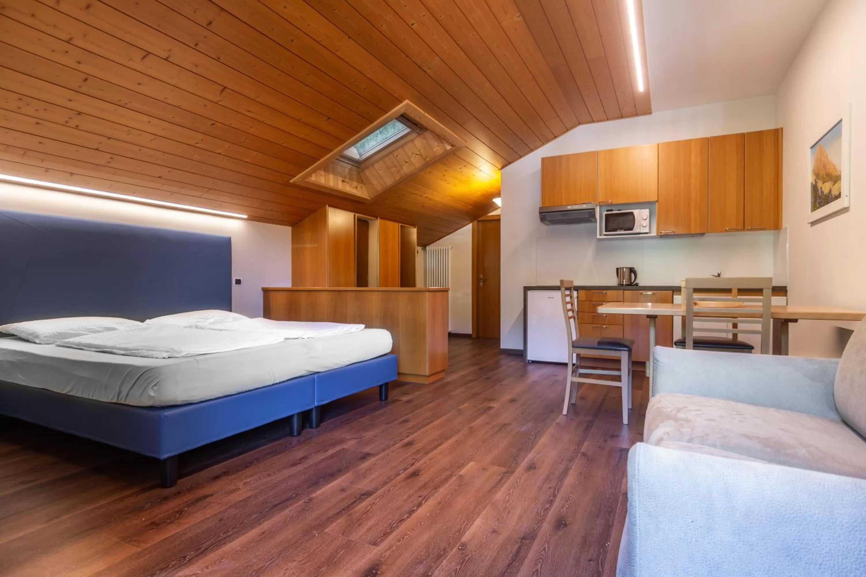 Kitchen or kitchenette, Bed in FORESTO - holiday apartments