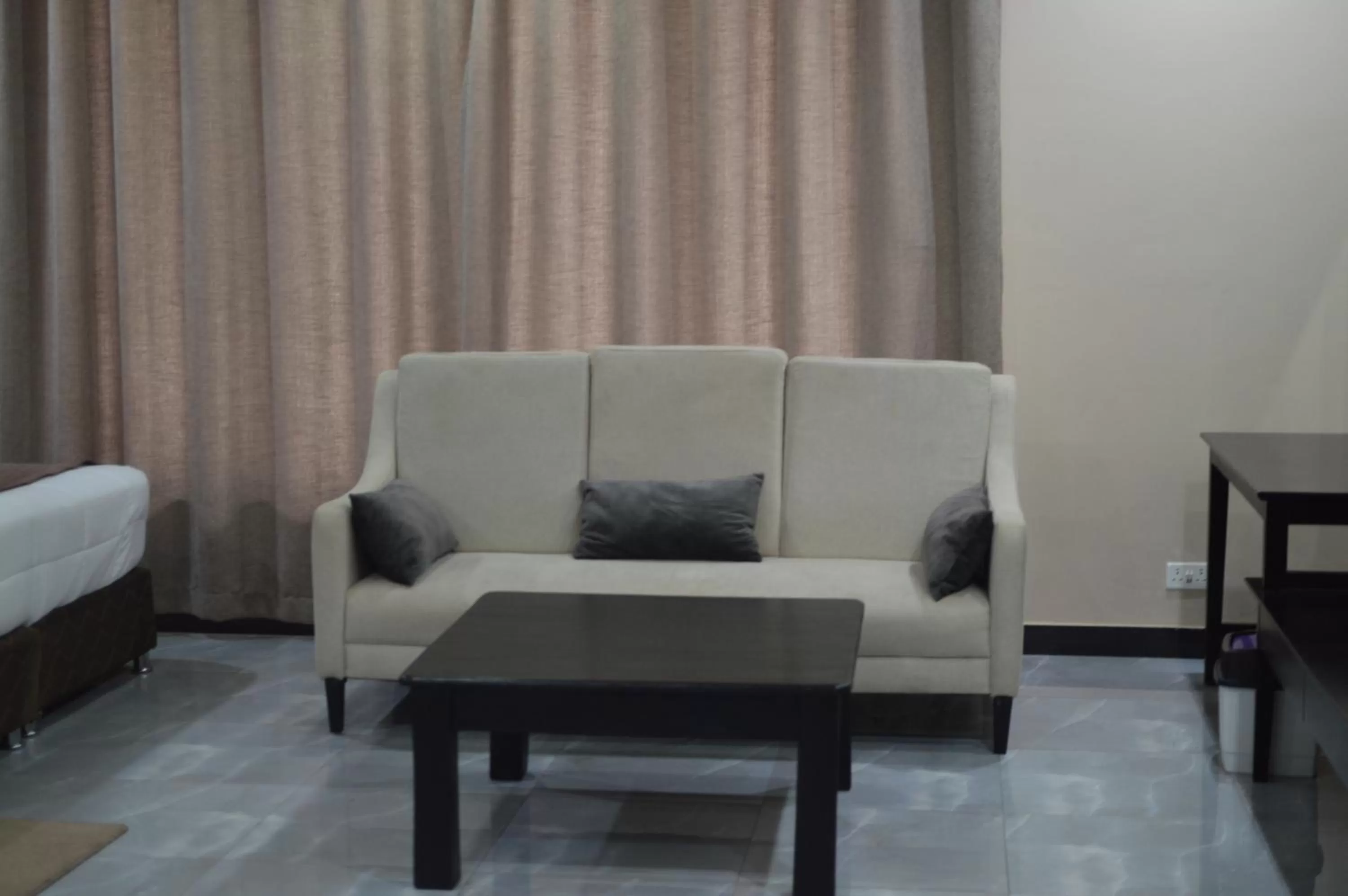 Seating area in Palm Kalash Hotel