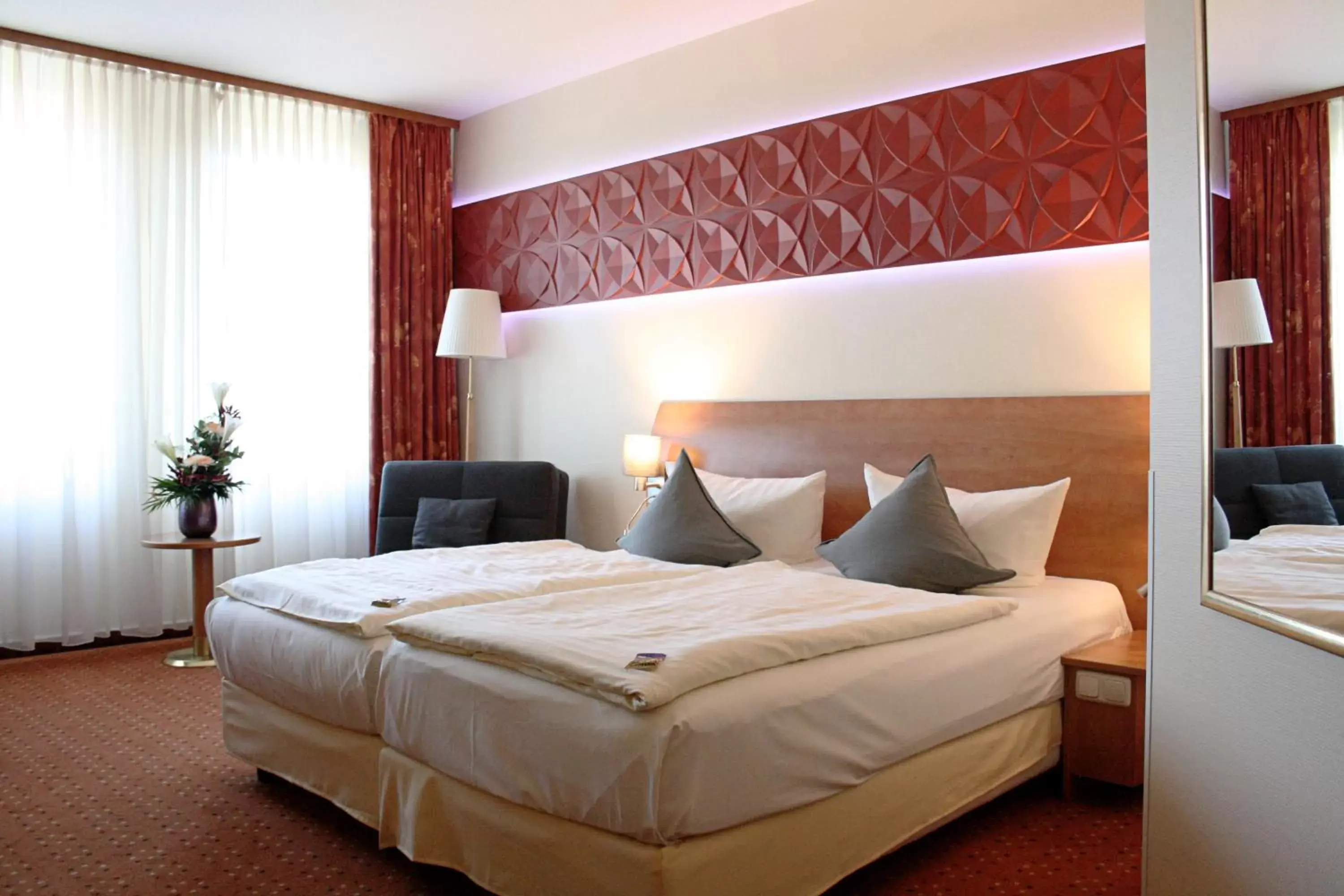 Photo of the whole room, Bed in Hotel Mercator Itzehoe-Klosterforst