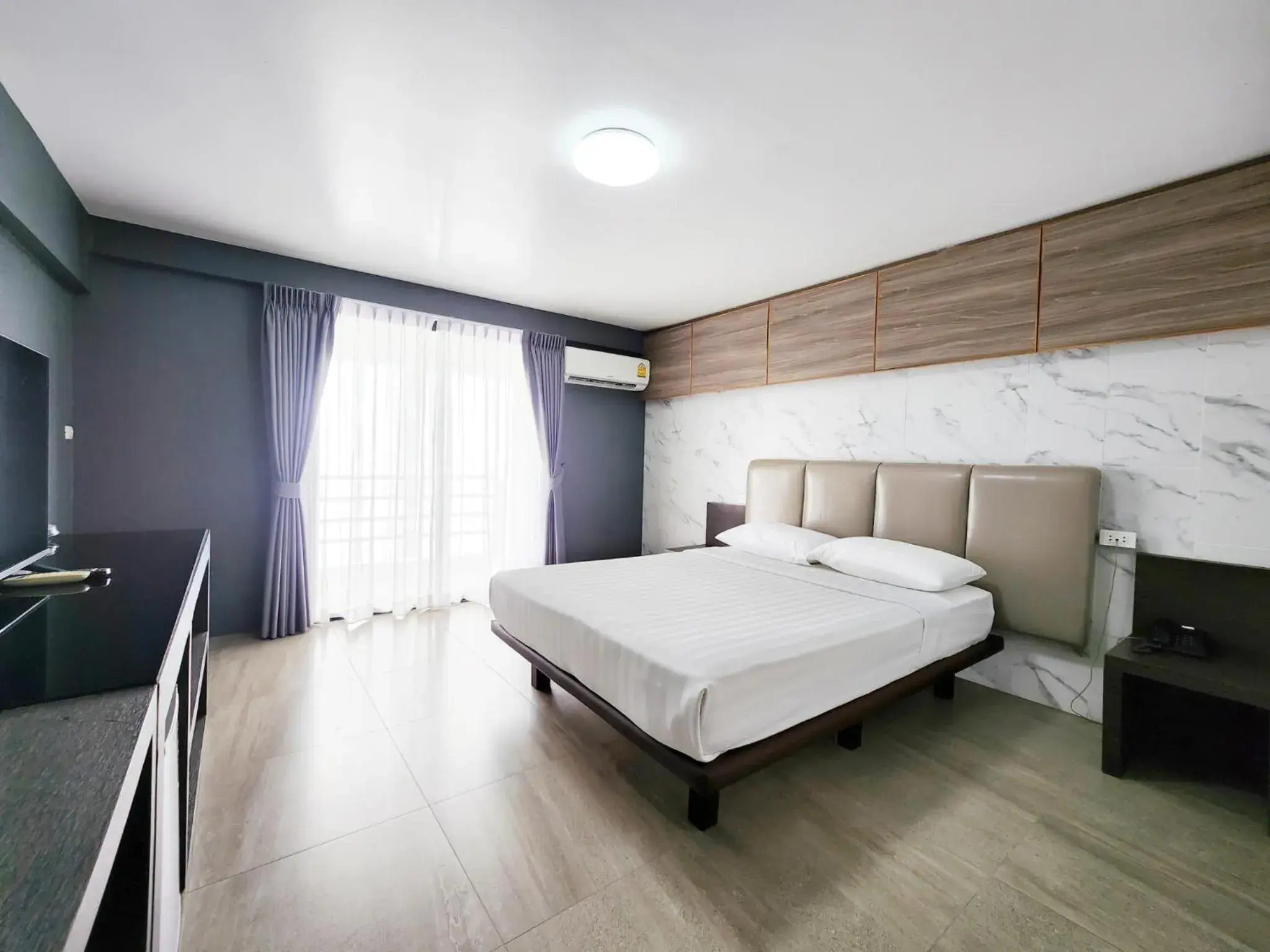 Bed in Watana Hotel