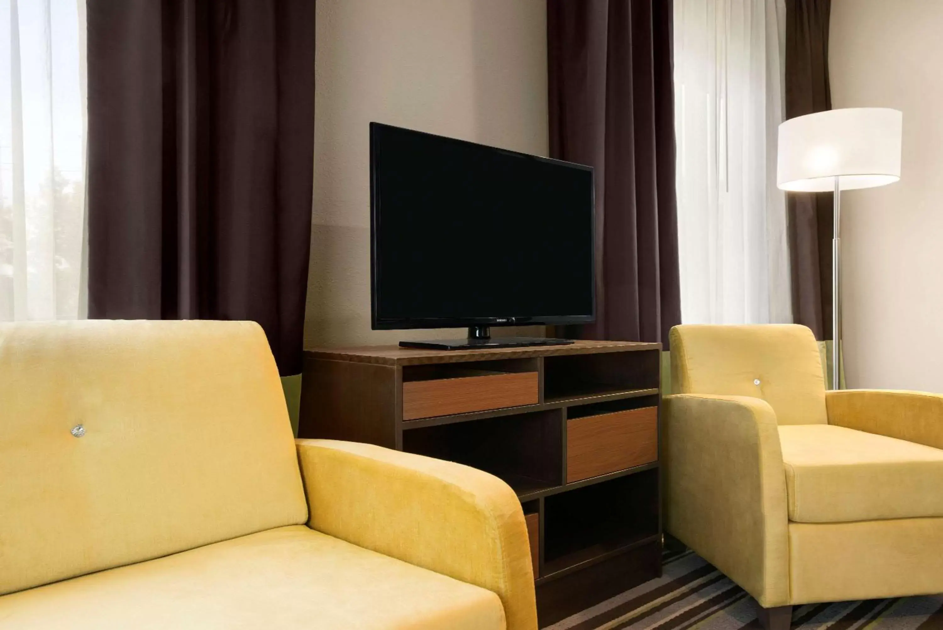 Photo of the whole room, TV/Entertainment Center in Super 8 by Wyndham Hershey