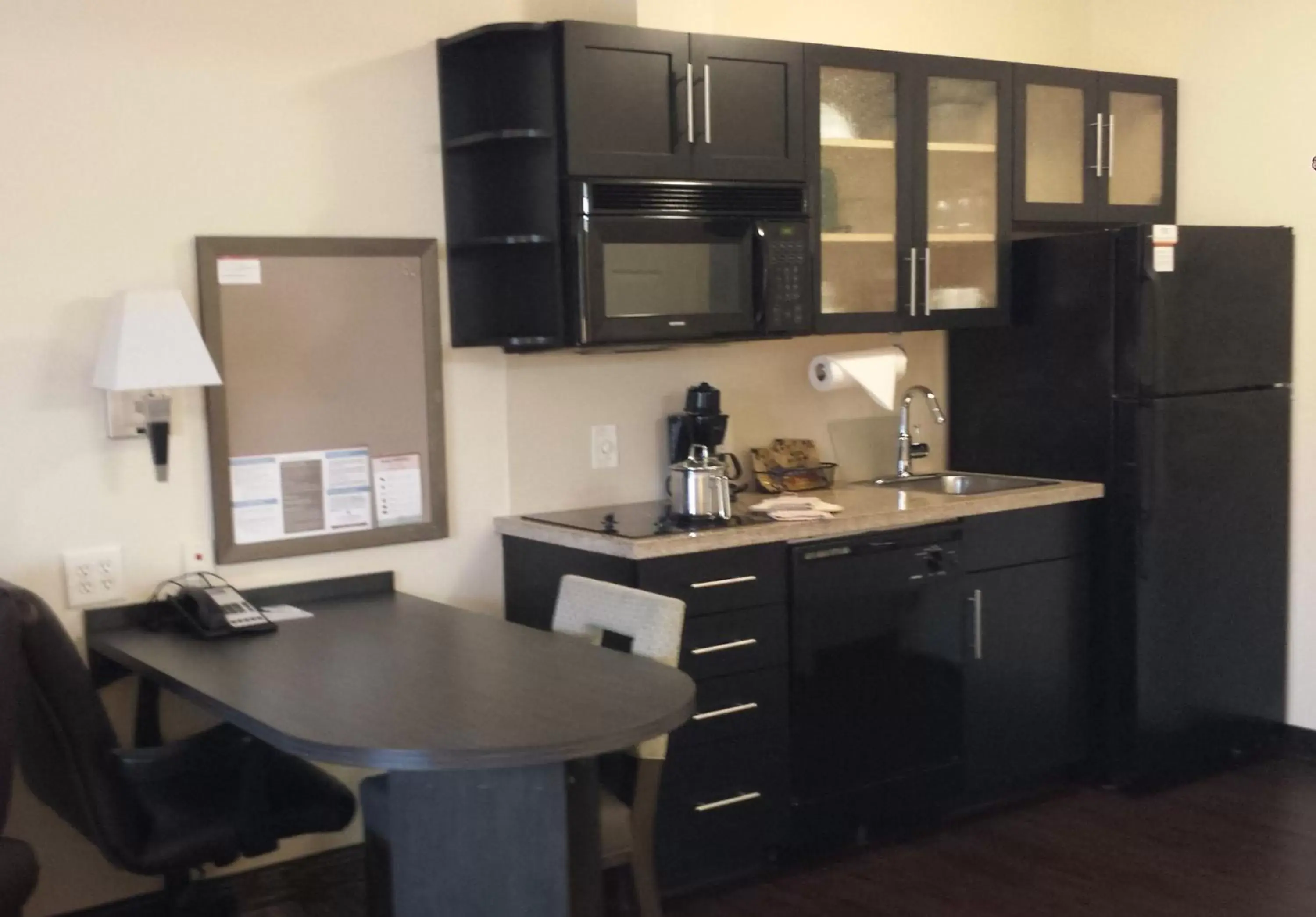 Photo of the whole room, Kitchen/Kitchenette in Candlewood Suites Greenville NC, an IHG Hotel