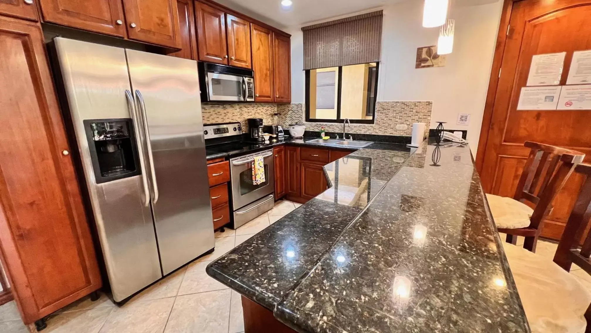 Living room, Kitchen/Kitchenette in Monte Carlo Luxury Condominiums