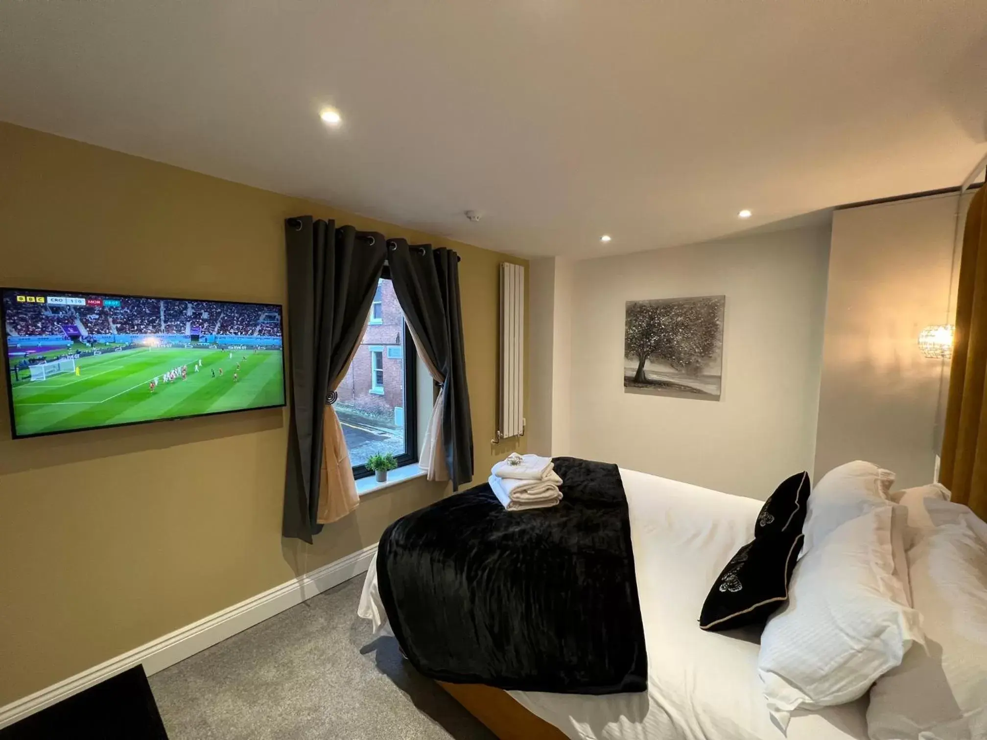 Bedroom, TV/Entertainment Center in Winckley Square Residences
