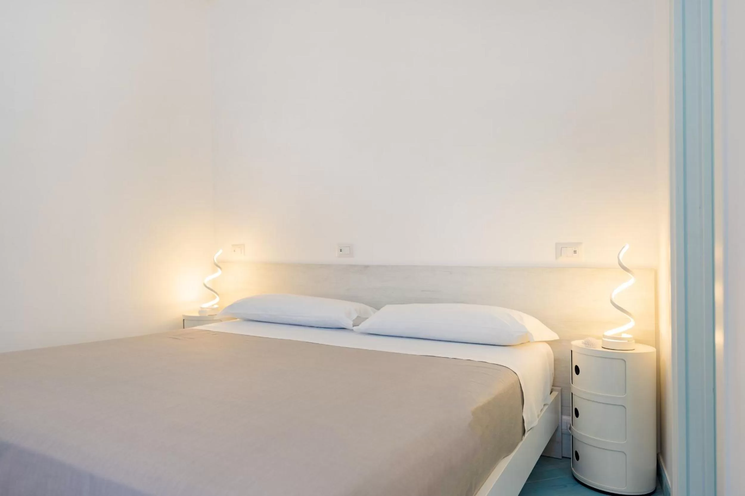 Bed in Poseidonia Rooms