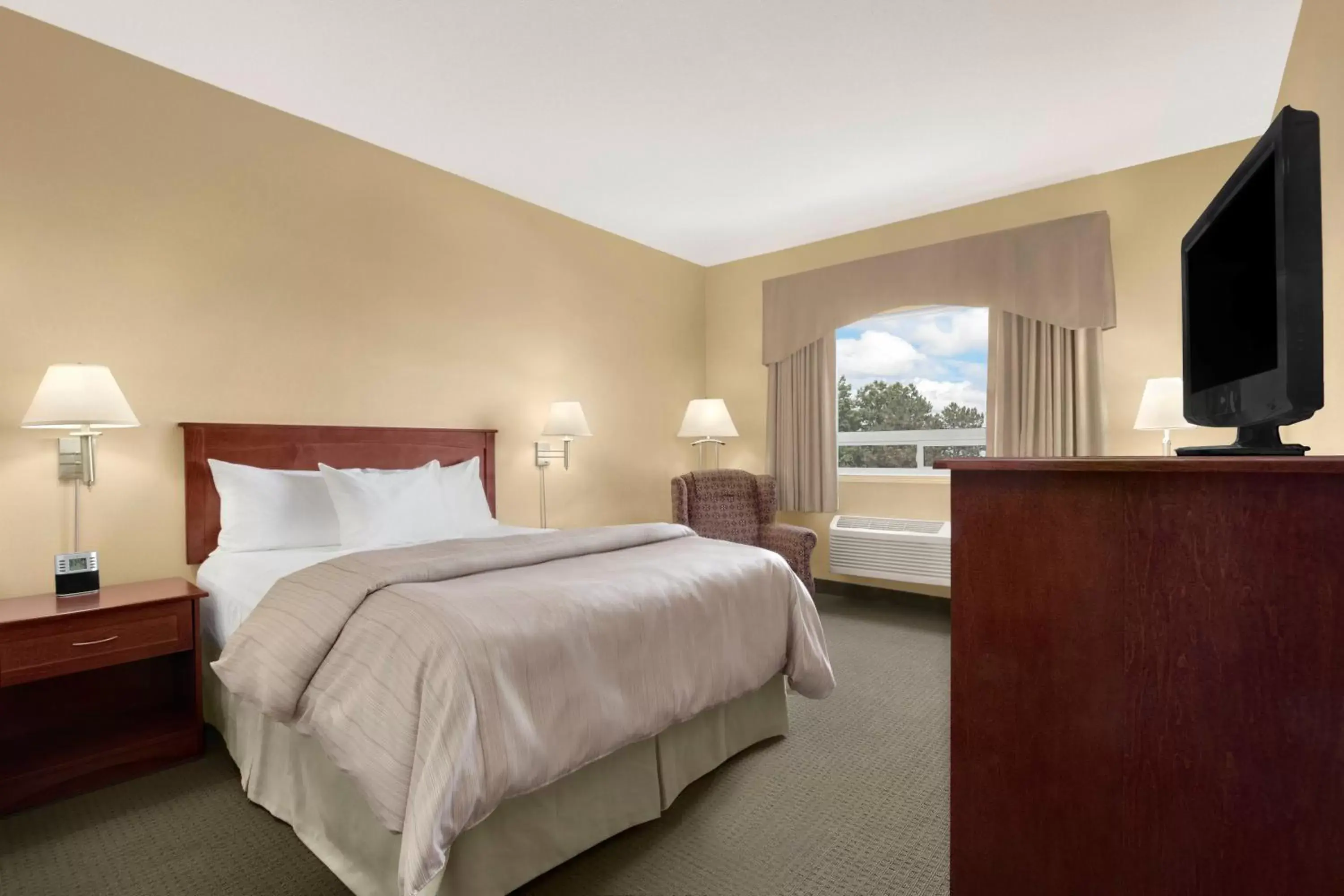 Bed in Days Inn & Suites by Wyndham Brandon