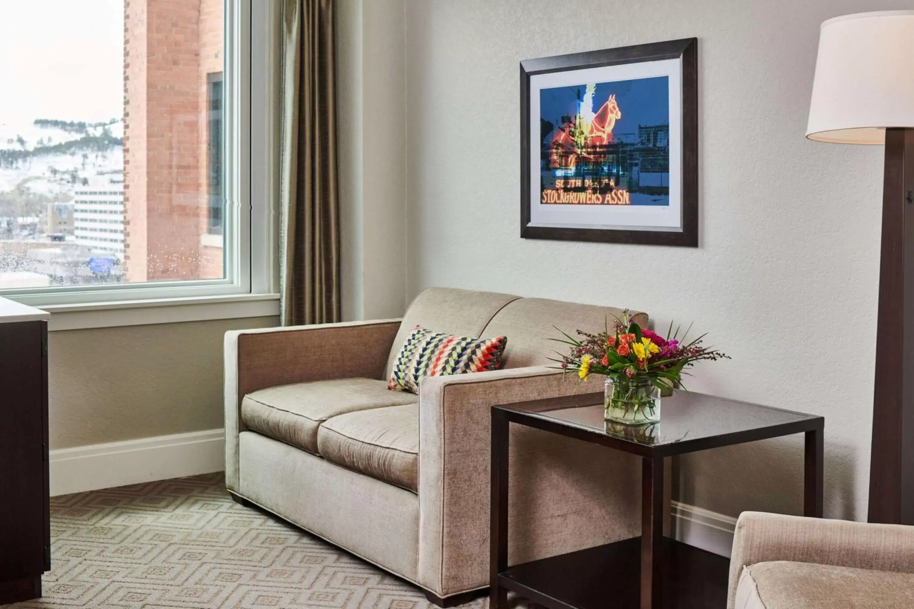 Living room, Seating Area in Hotel Alex Johnson Rapid City, Curio Collection by Hilton