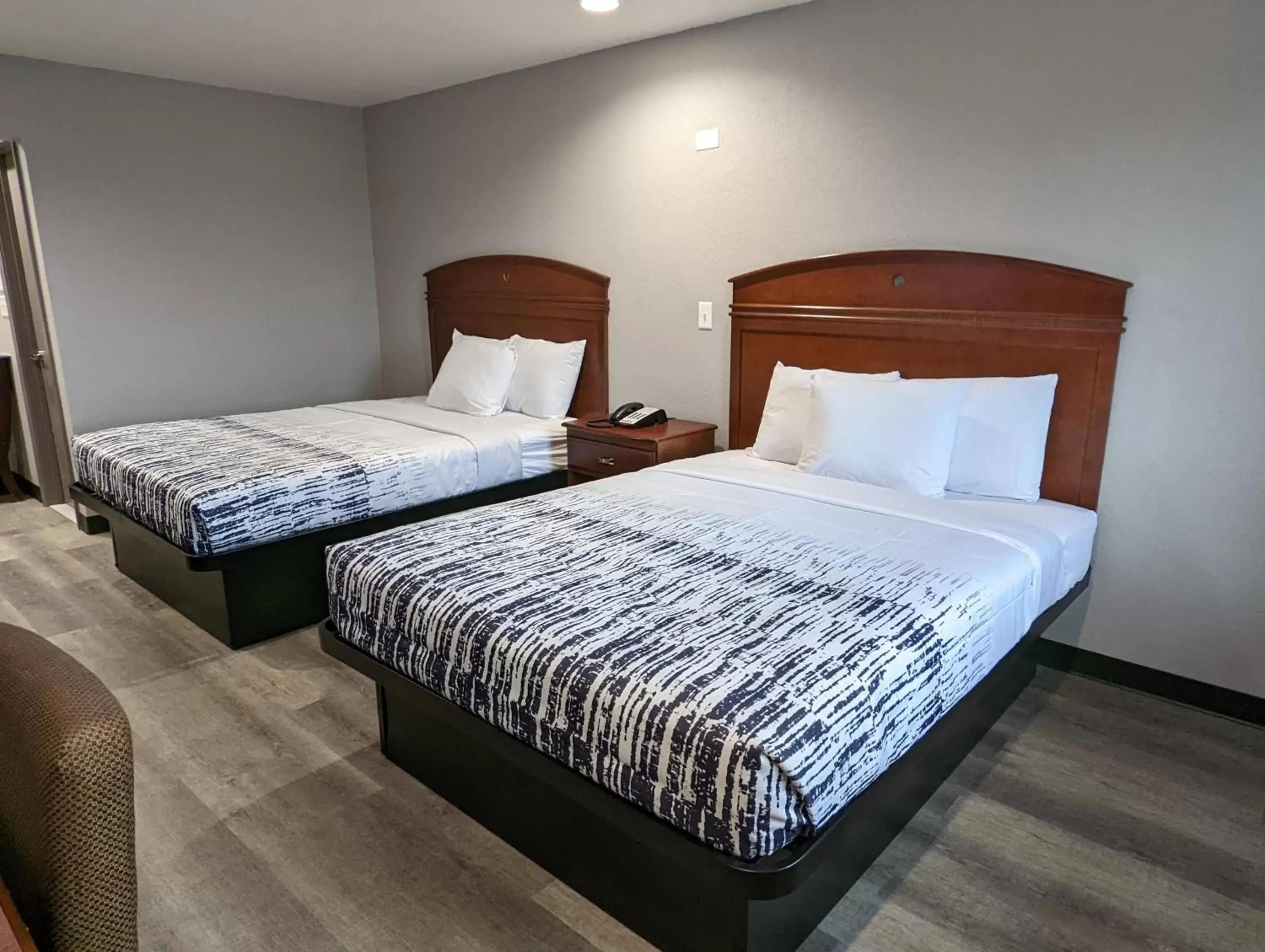 Communal lounge/ TV room, Bed in OKC Hotel Communal lounge/ TV room, Bed in OKC Hotel