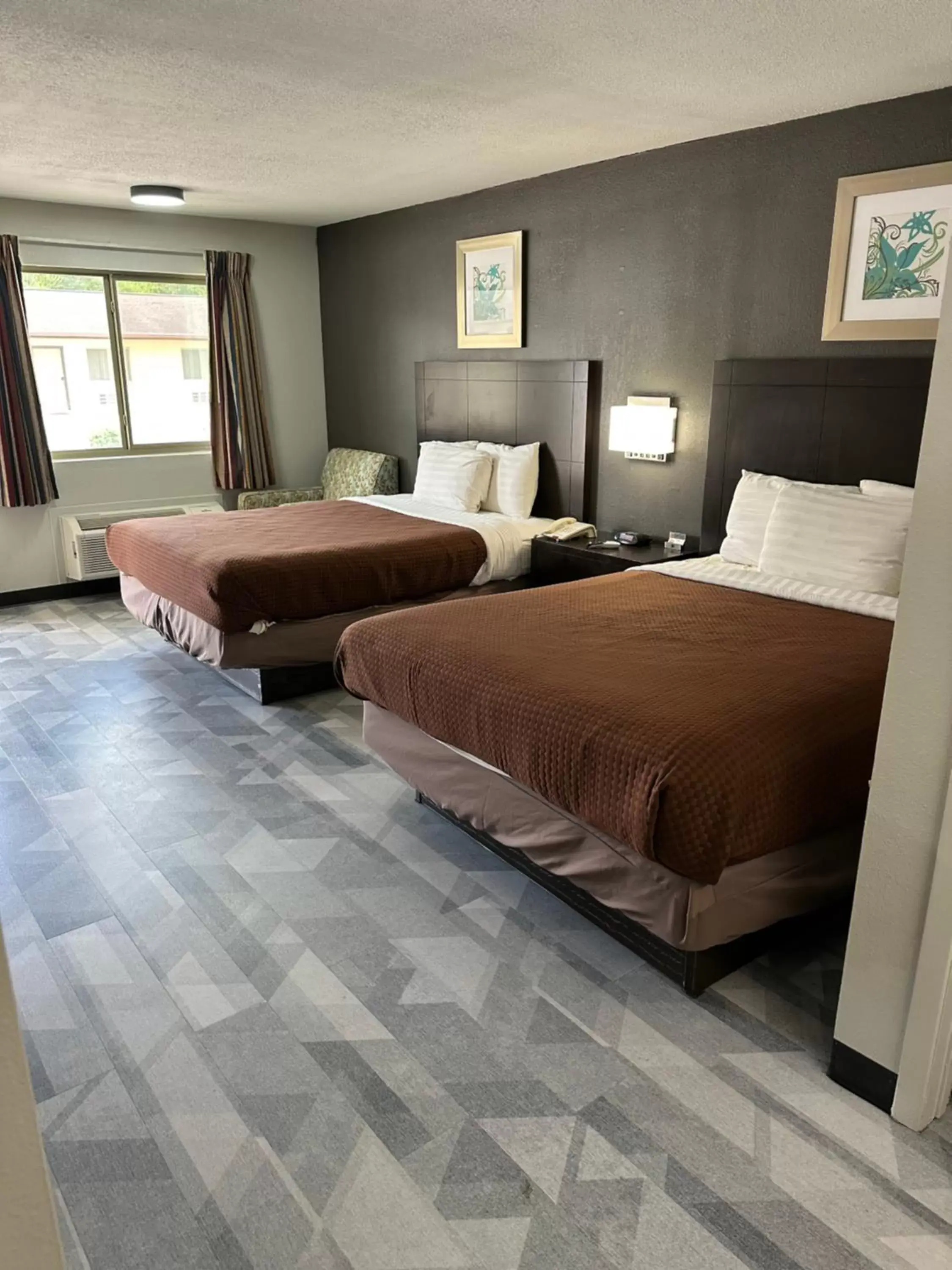 Bed in Freer Executive Inn & Suites
