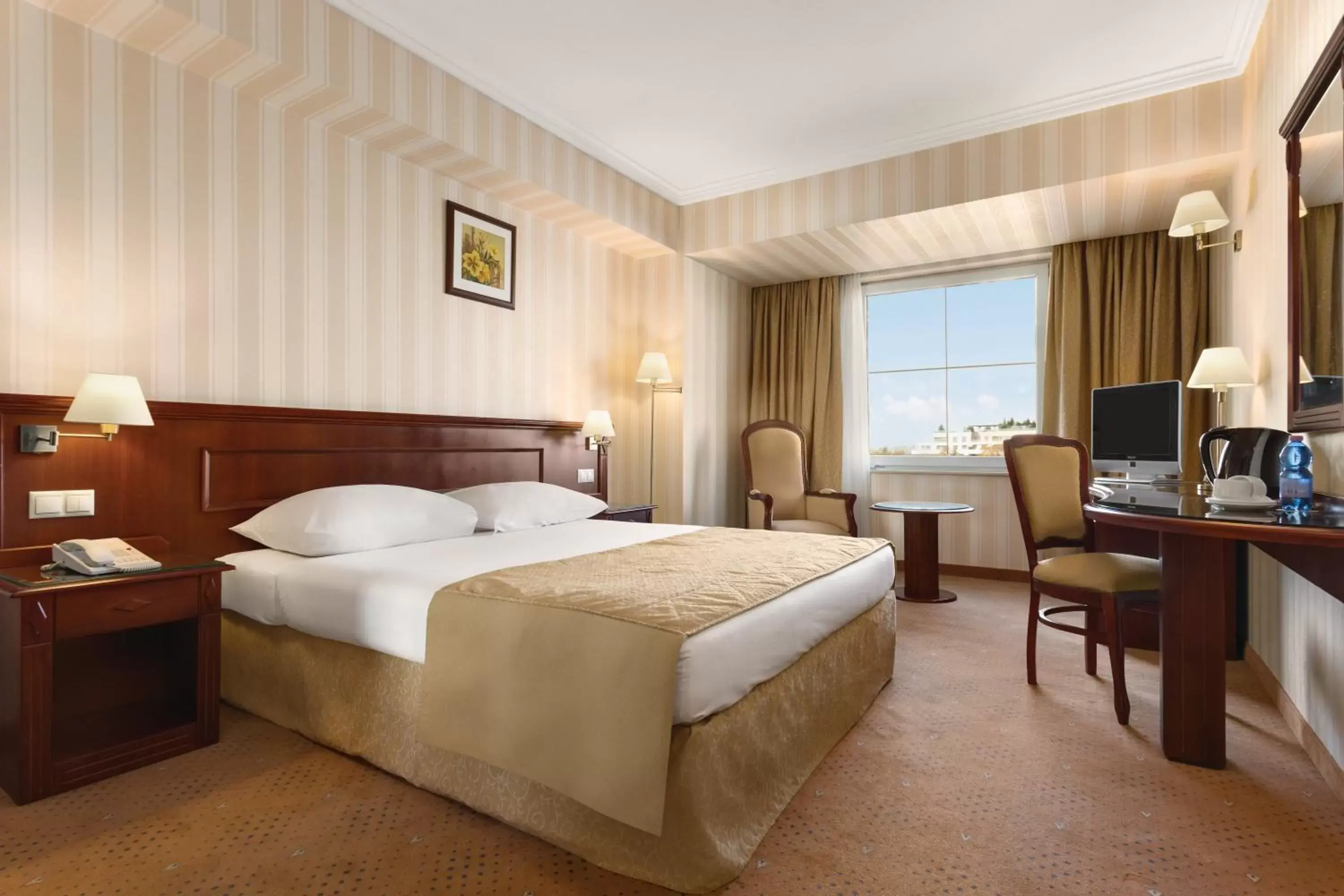 Photo of the whole room, Bed in Ramada Hotel & Suites by Wyndham Bucharest North