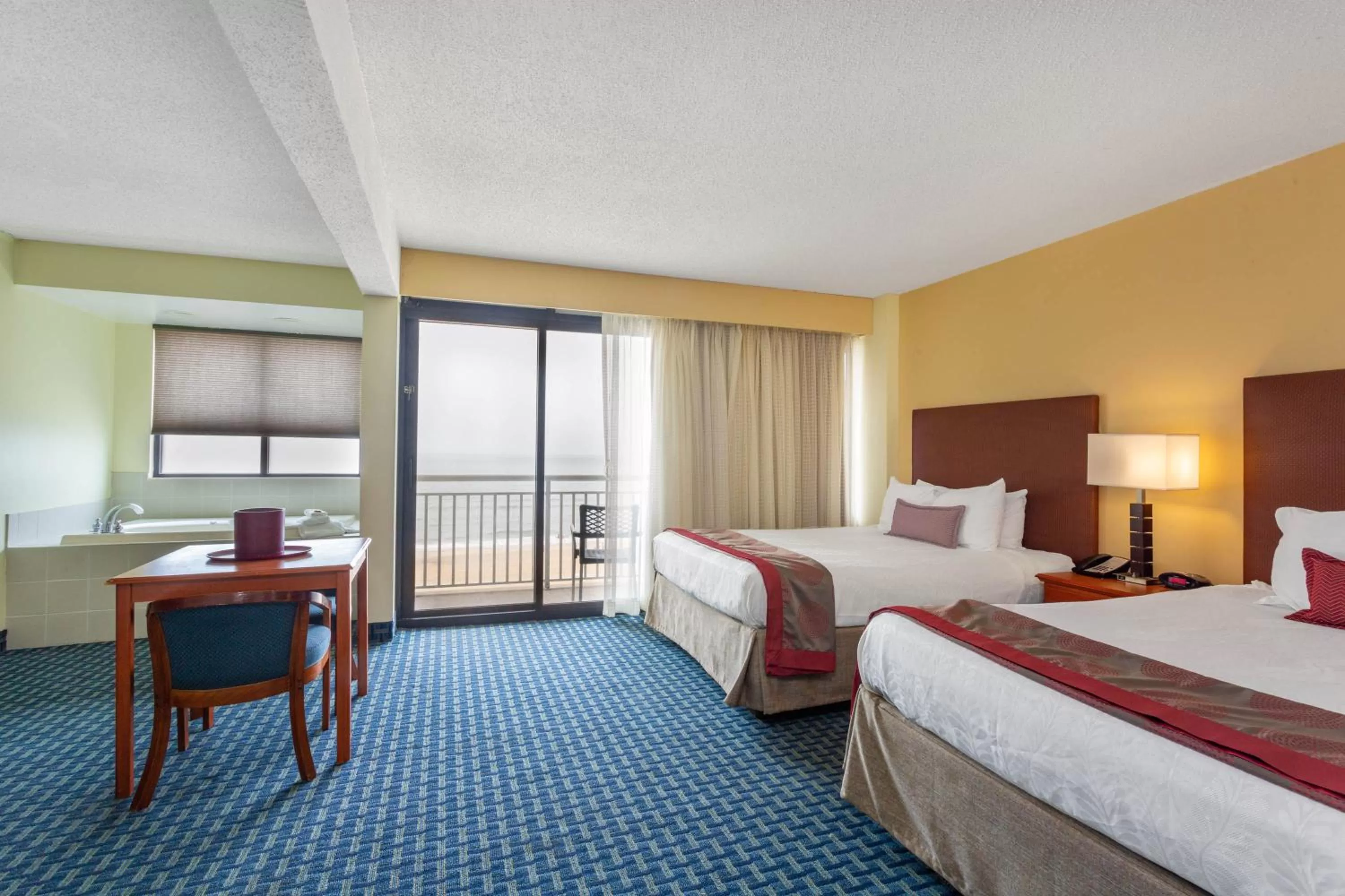 Bedroom, Bed in Ramada Plaza by Wyndham Virginia Beach Oceanfront