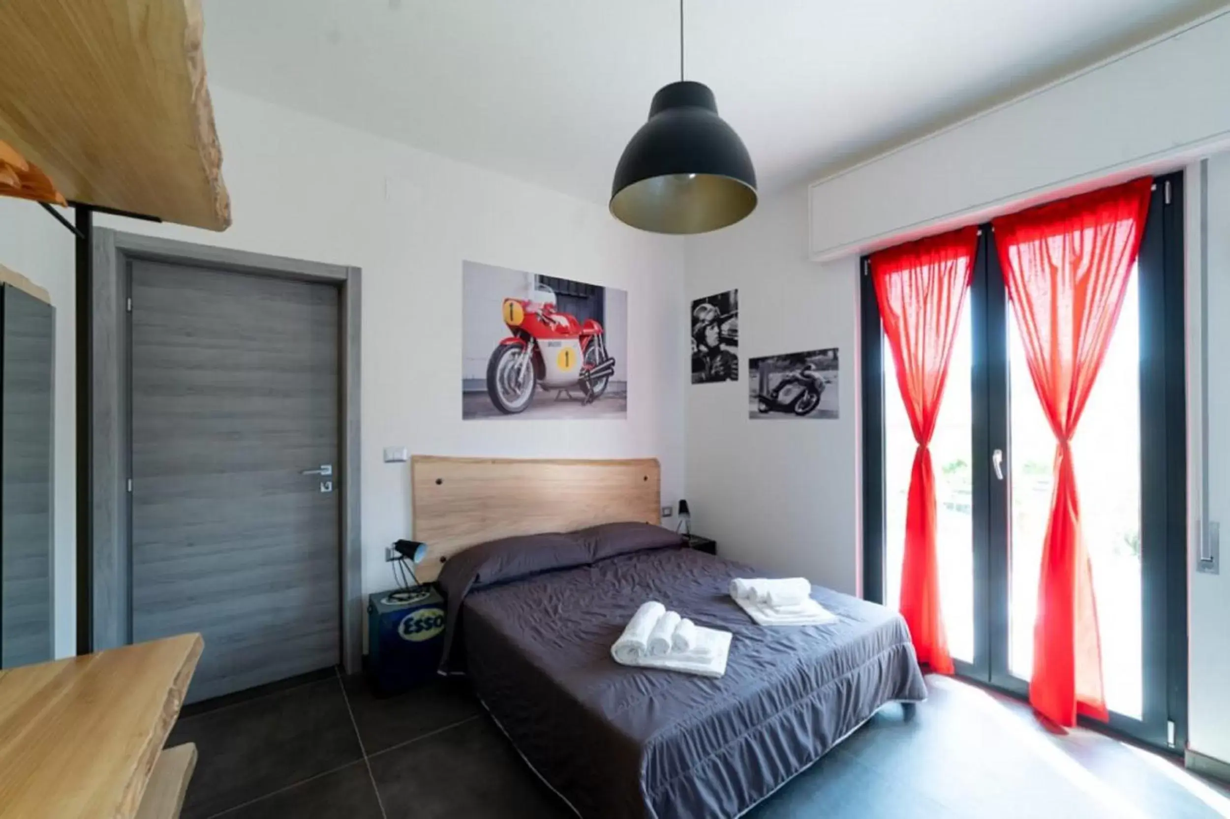 Photo of the whole room, Bed in Italian Piston House Sport Moto Rent