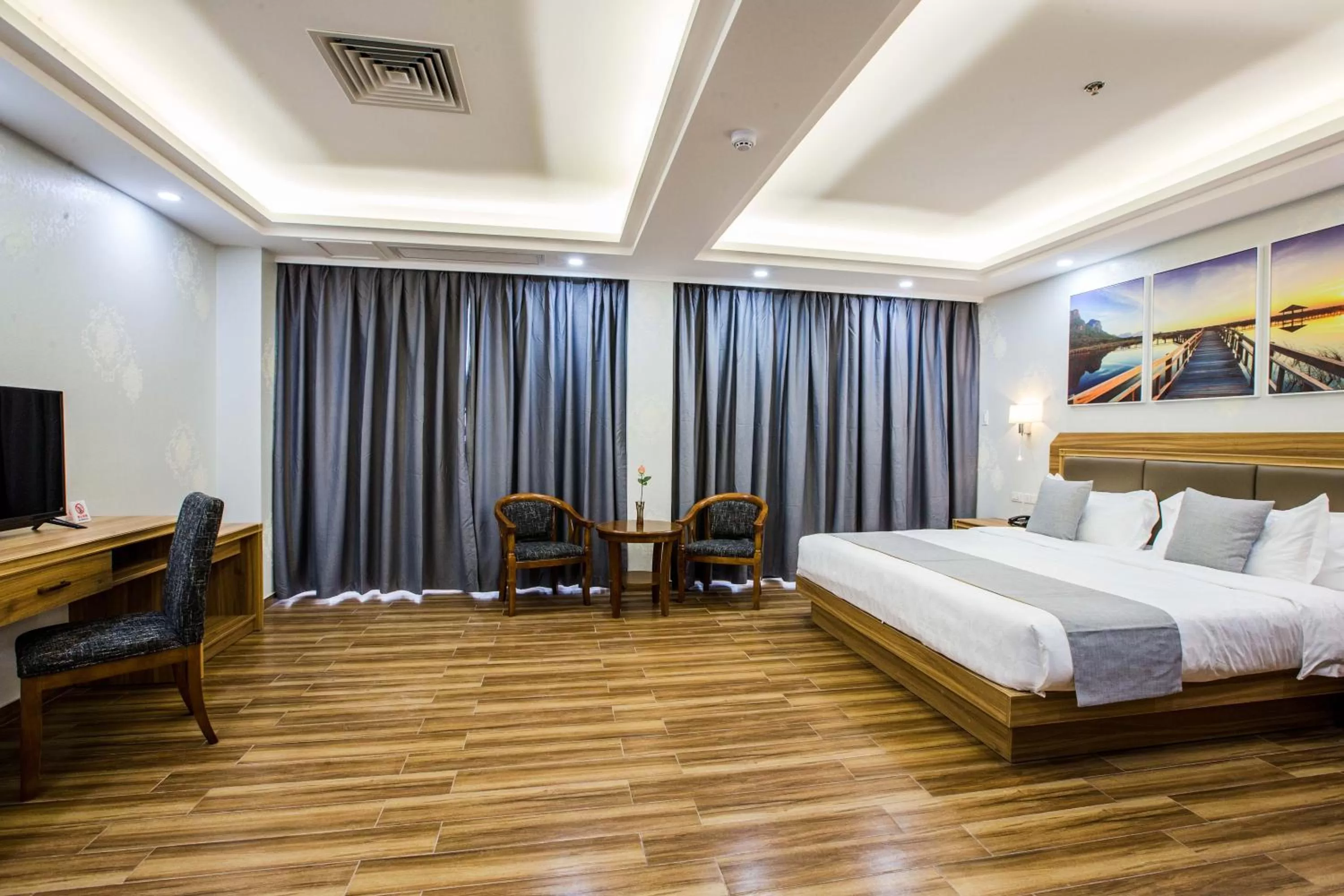 Living room, Bed in Costa Palawan Resort