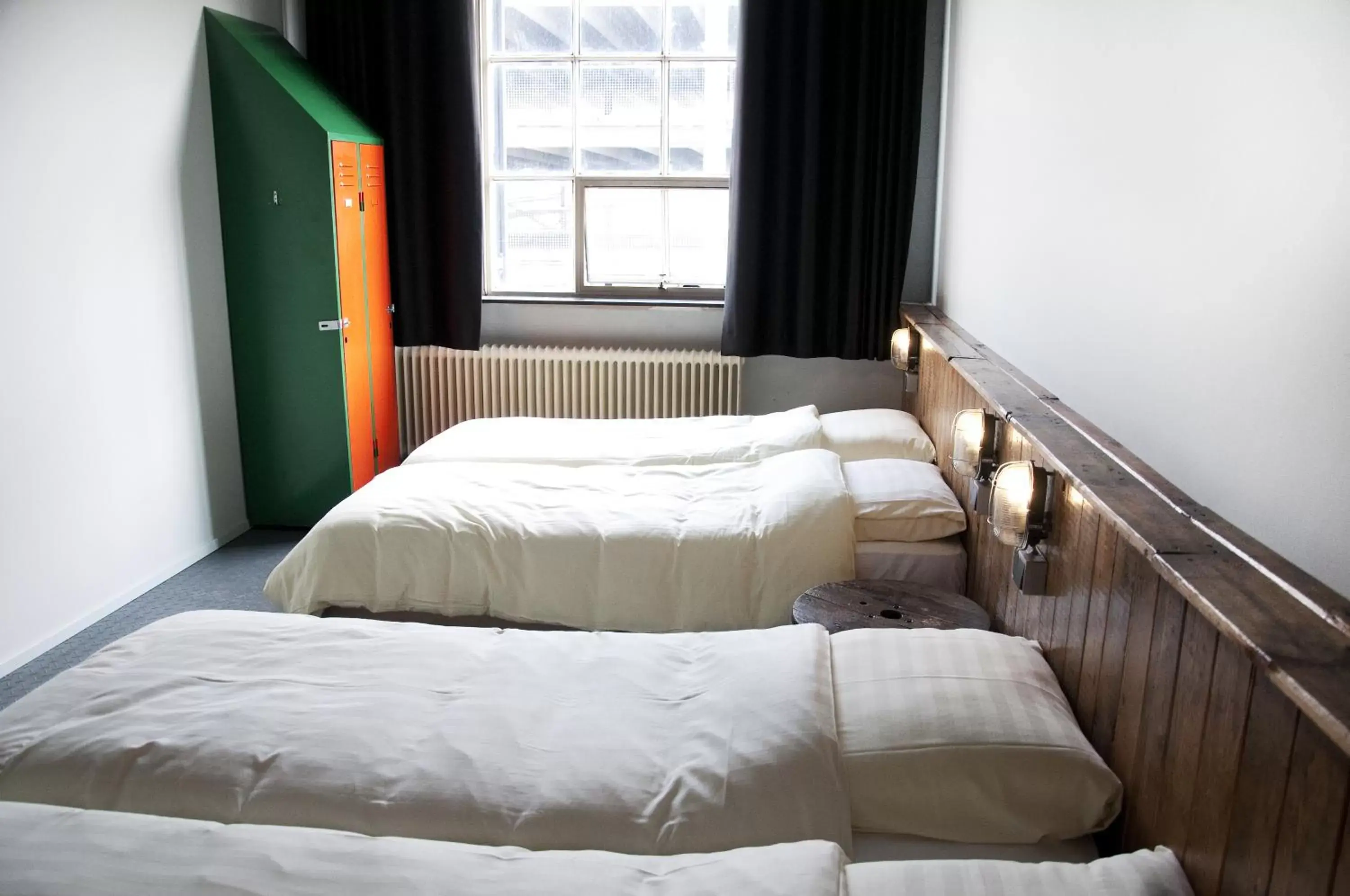 Bed in Blue Collar Hotel