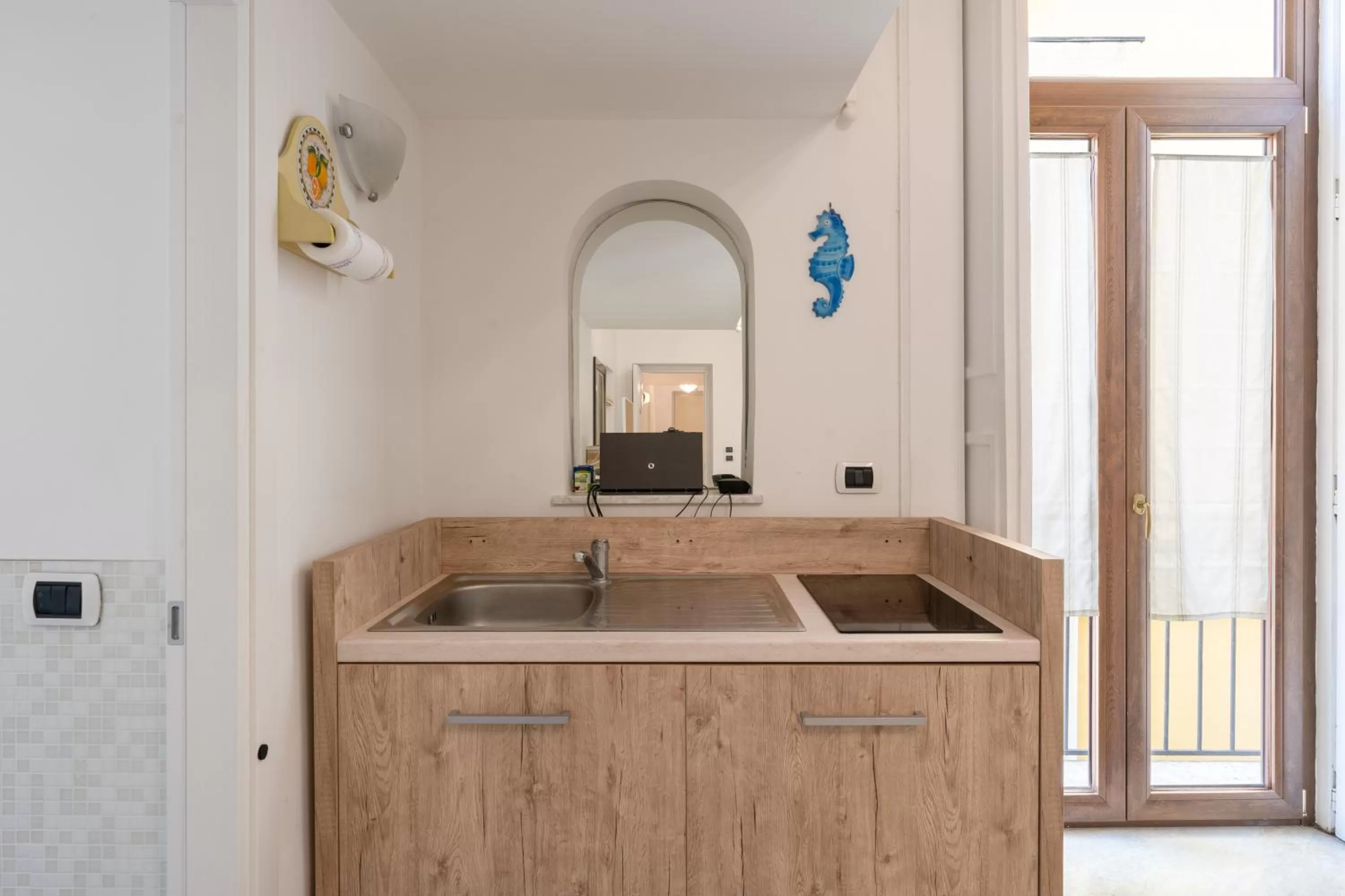 Kitchen or kitchenette in The Charming Suites