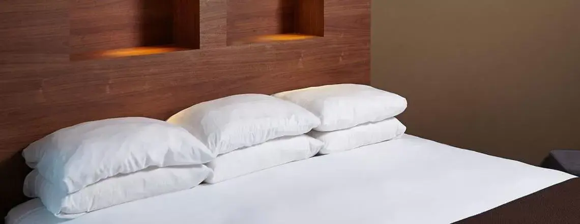 Bed in CityFlatsHotel - Grand Rapids, Ascend Hotel Collection