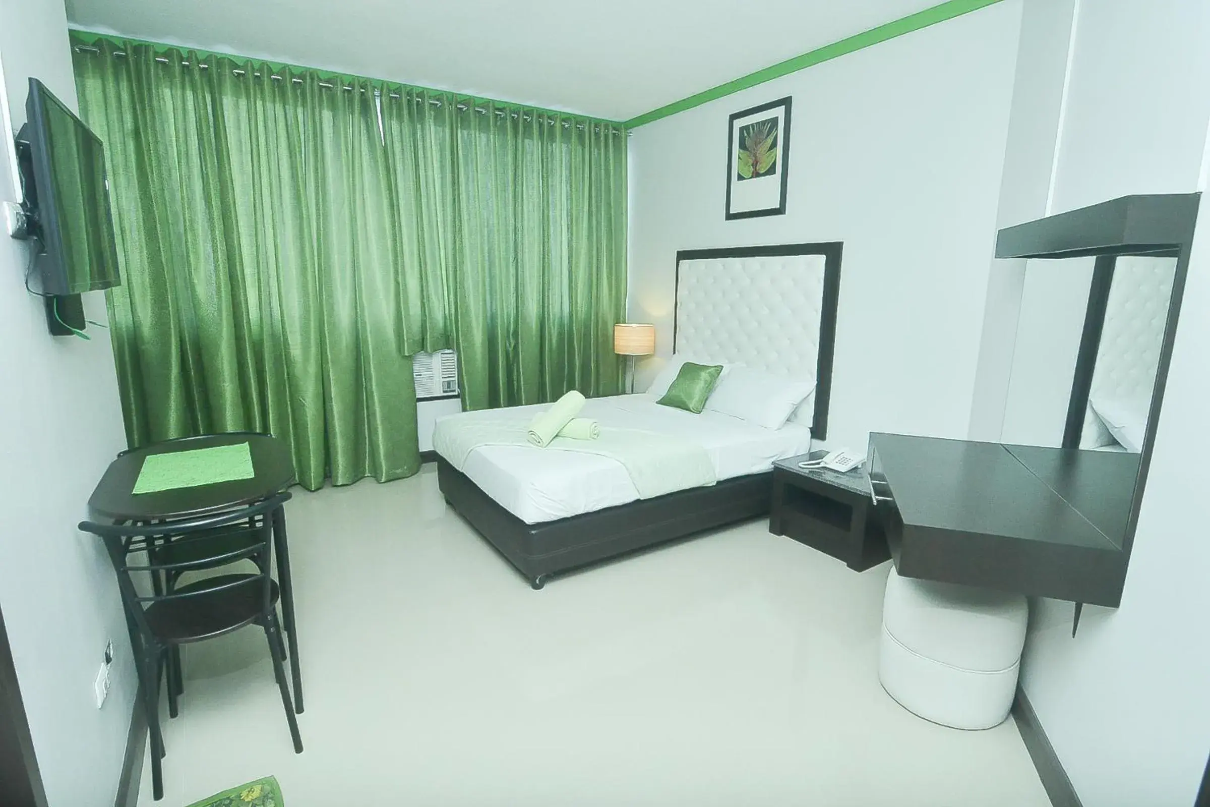 Bed in Green Banana Business Hotel