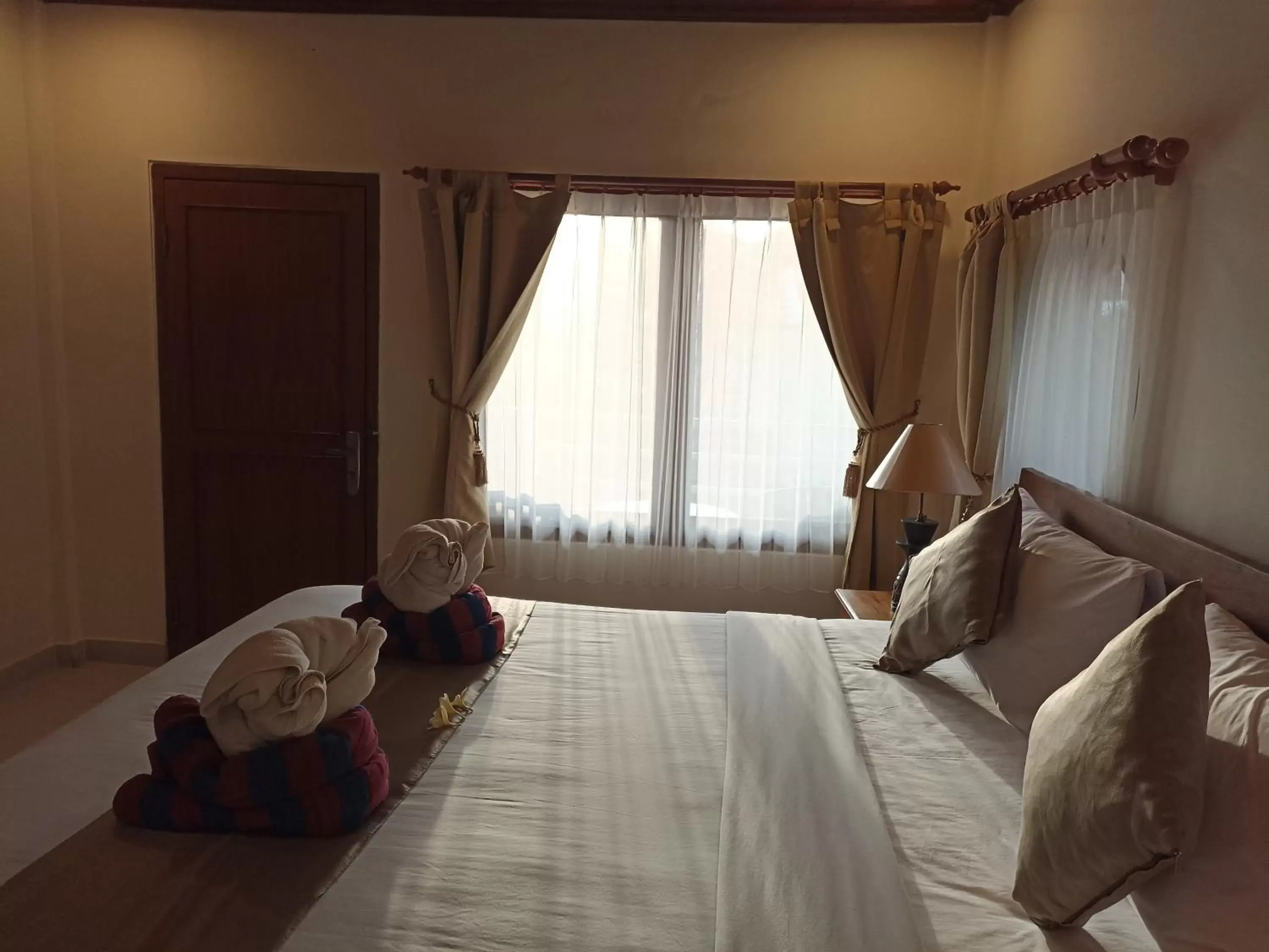 Bed in Kusnadi Hotel
