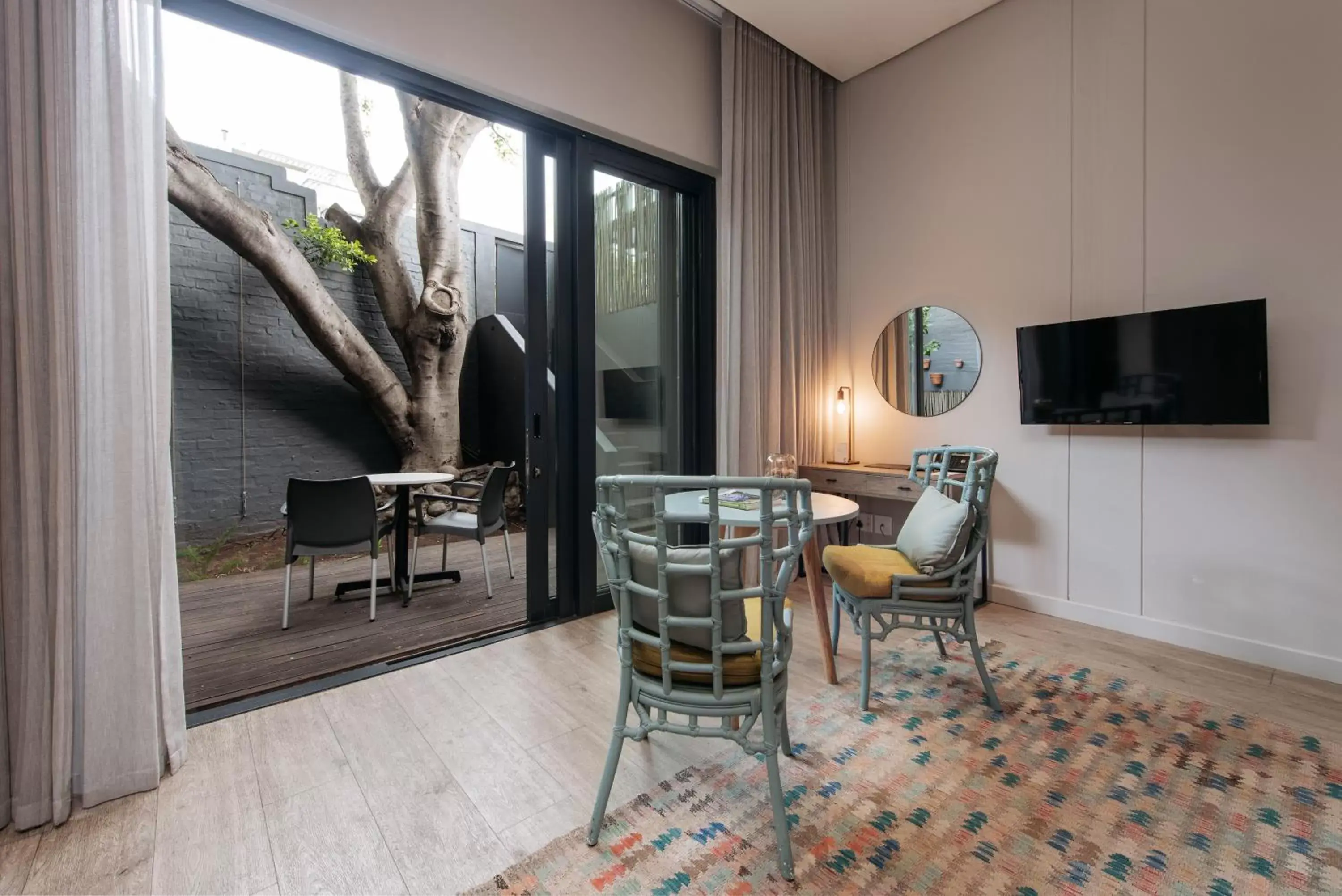 Patio, TV/Entertainment Center in The Tree House Boutique Hotel by The Living Journey Collection