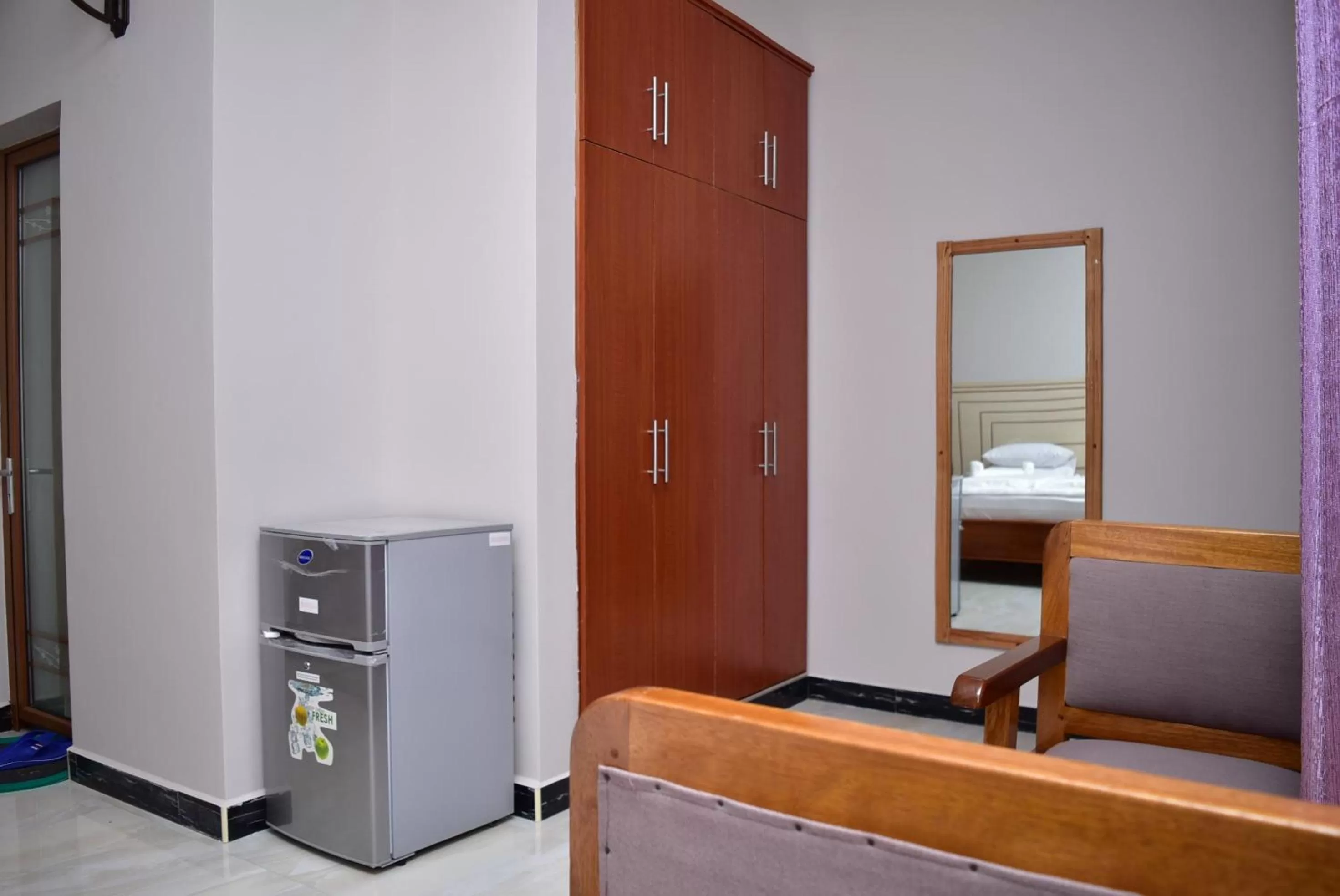 Bed, TV/Entertainment Center in Hancol Hotel