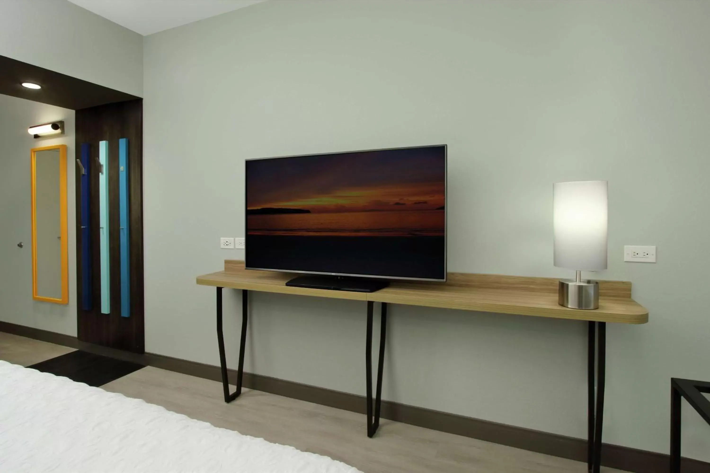 Photo of the whole room, TV/Entertainment Center in Tru By Hilton Meridian