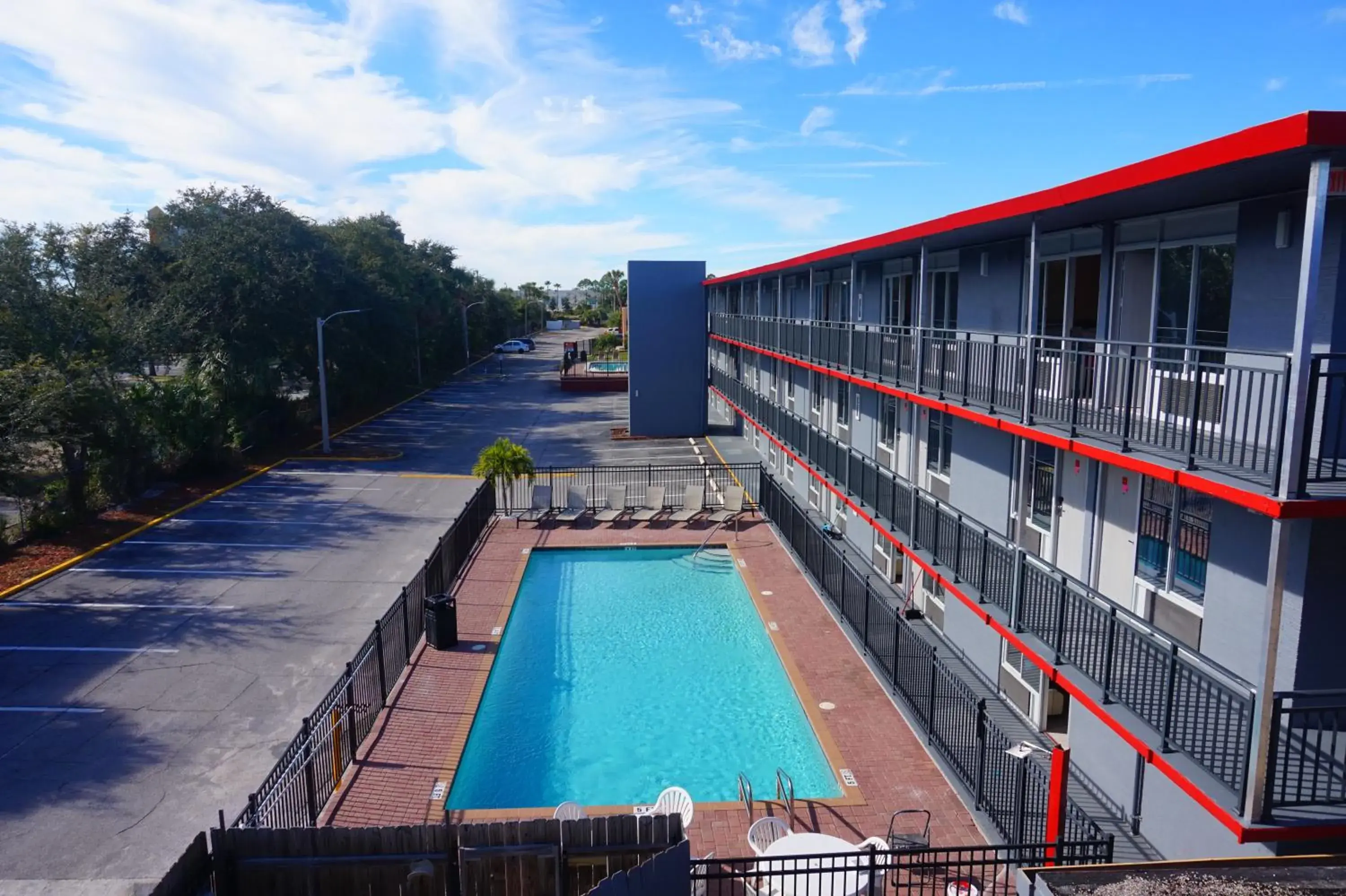 Balcony/Terrace, Swimming Pool in Travelodge by Wyndham Orlando at Heart of International Drive