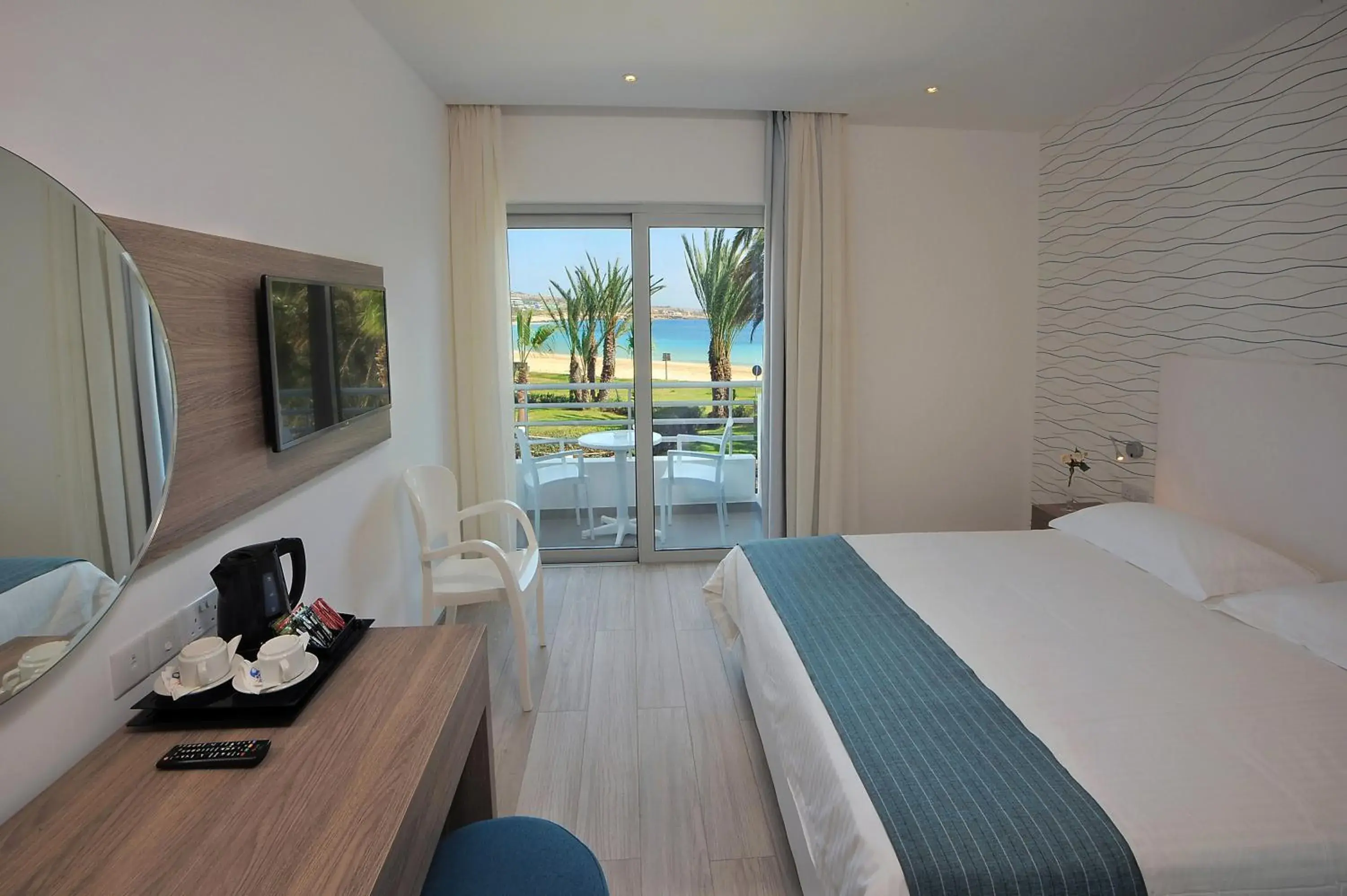 Bed in Okeanos Beach Boutique Hotel