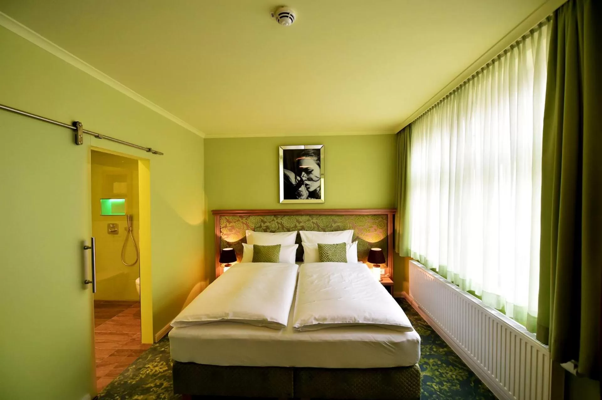 Photo of the whole room, Bed in MOMENTS Boutique Hotel