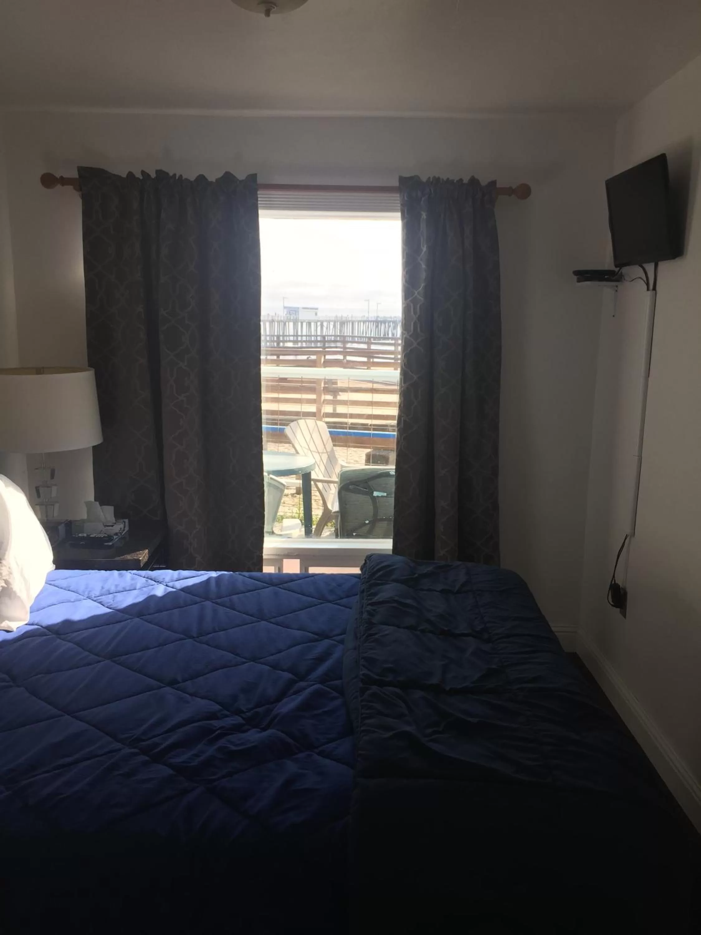 Bed in Dolphin Cove Motel