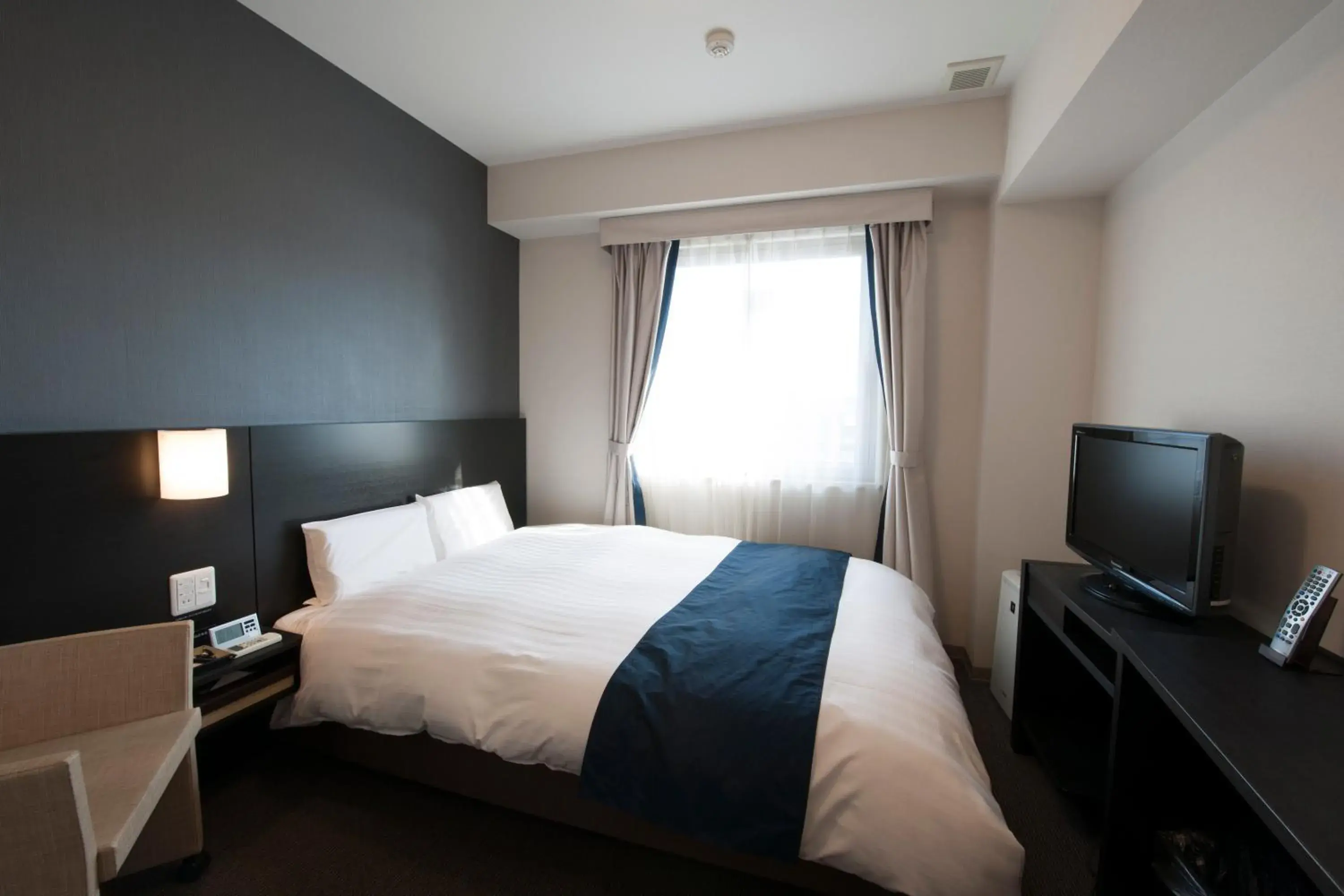 Bed in Dormy Inn Premium Shimonoseki