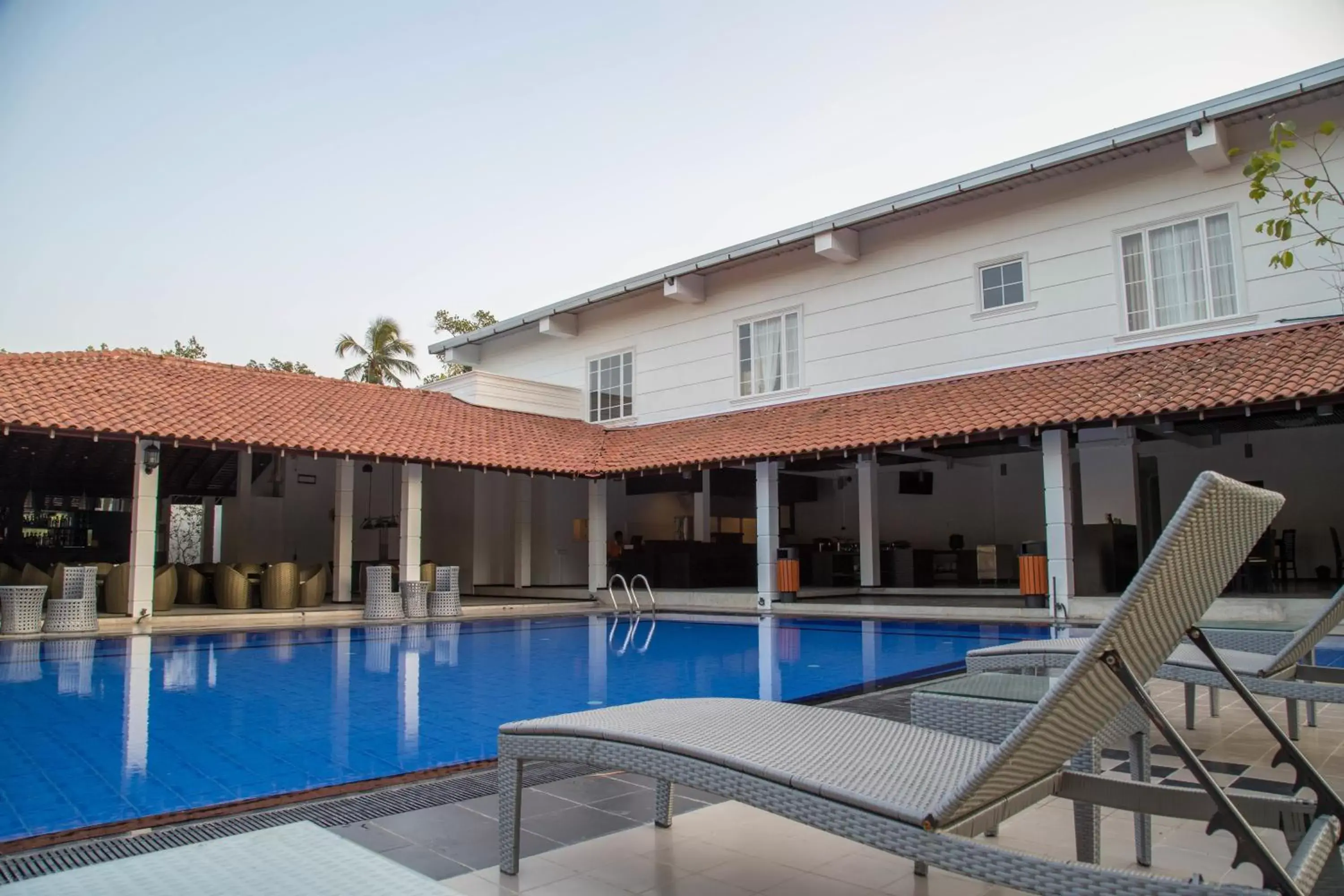 Swimming pool, Property Building in The Covanro Airport Hotel - Katunayake