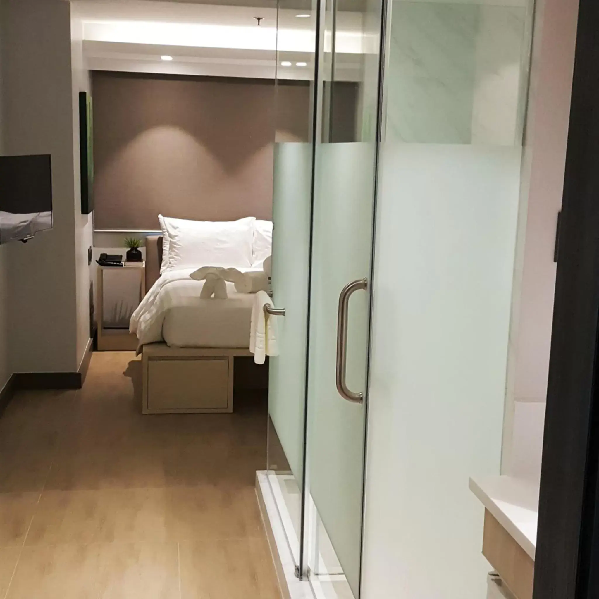 Bathroom, Bed in The Mini Suites - Eton Tower Makati
