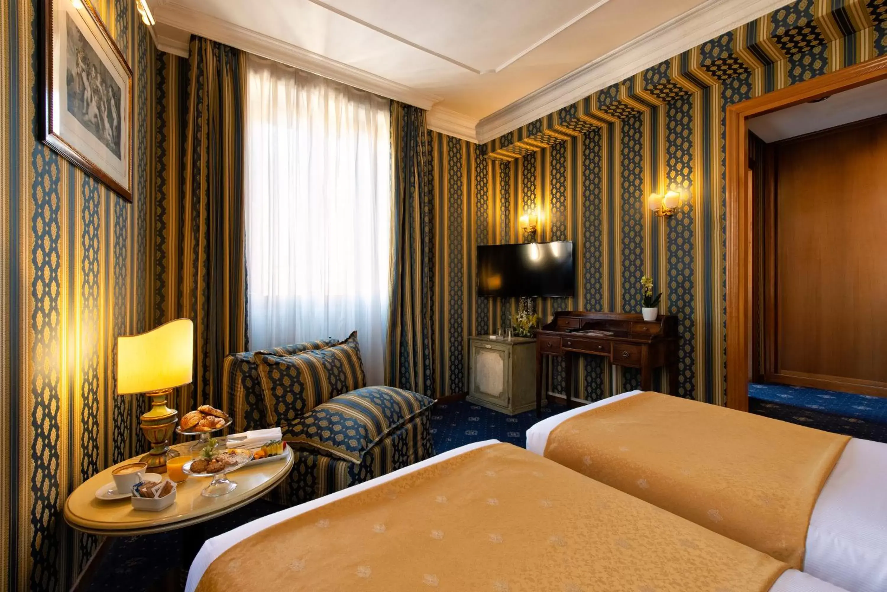 Bedroom, Seating Area in Atlante Star Hotel