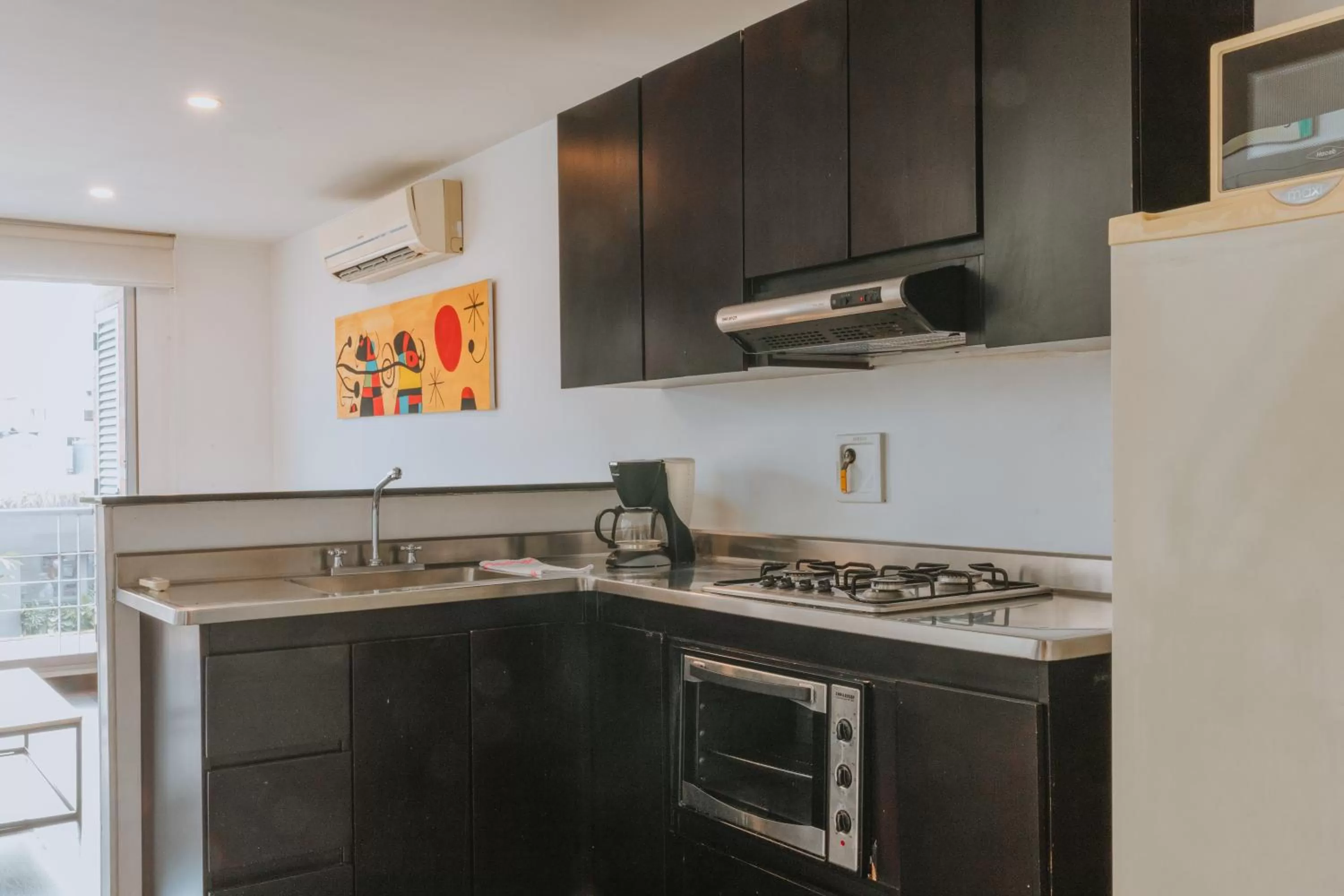 kitchen in Travelers Orange Suites