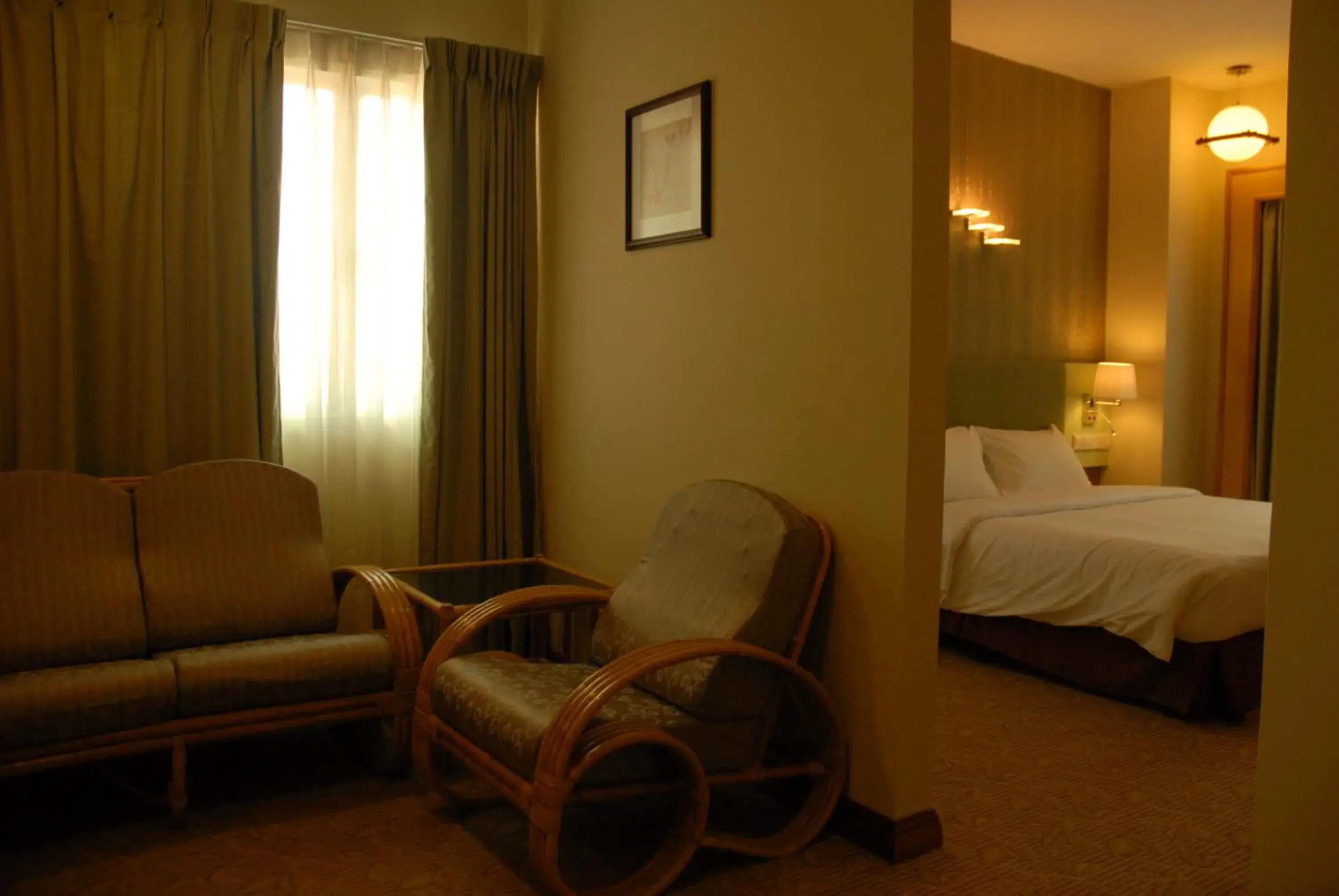 Bed, Seating Area in The Pavilion Hotel