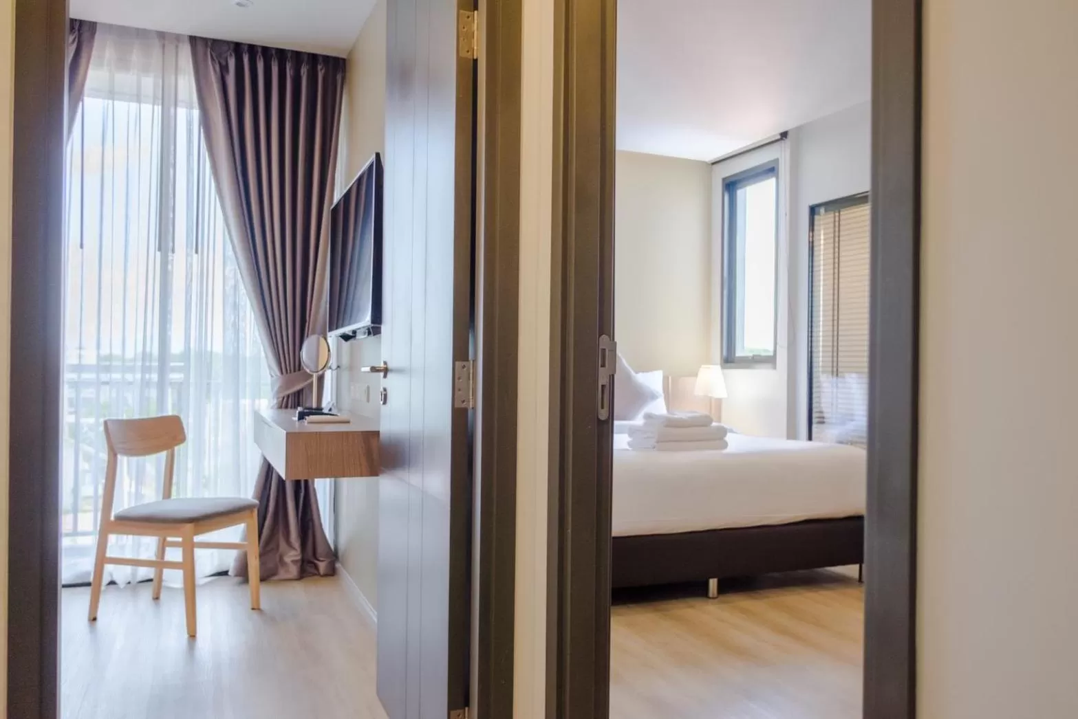 Photo of the whole room, Bed in The Rise Suites Hotel, Chiang Mai - SHA Extra Plus