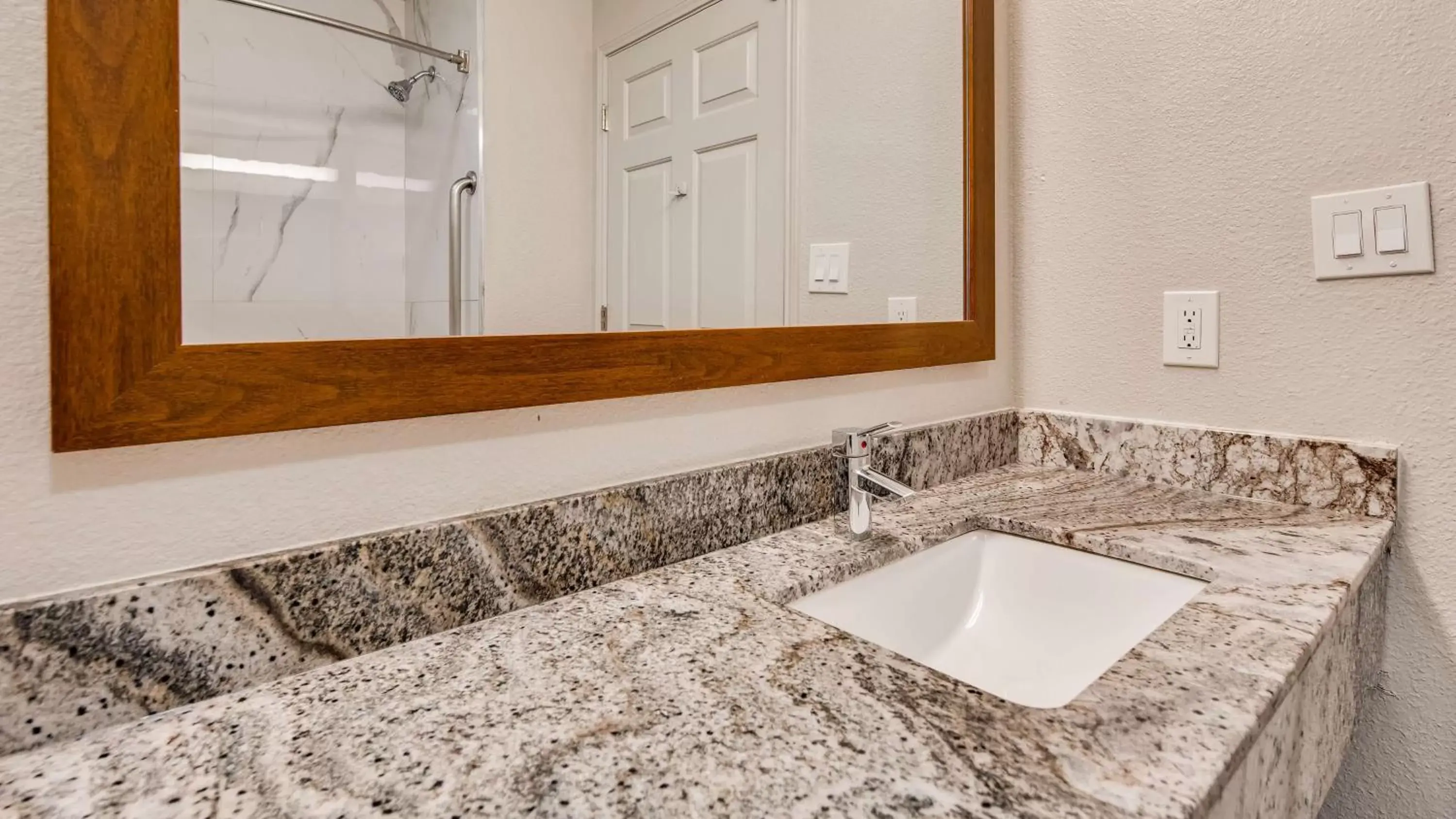 Bathroom in SureStay Plus Hotel by Best Western Ft Worth Benbrook