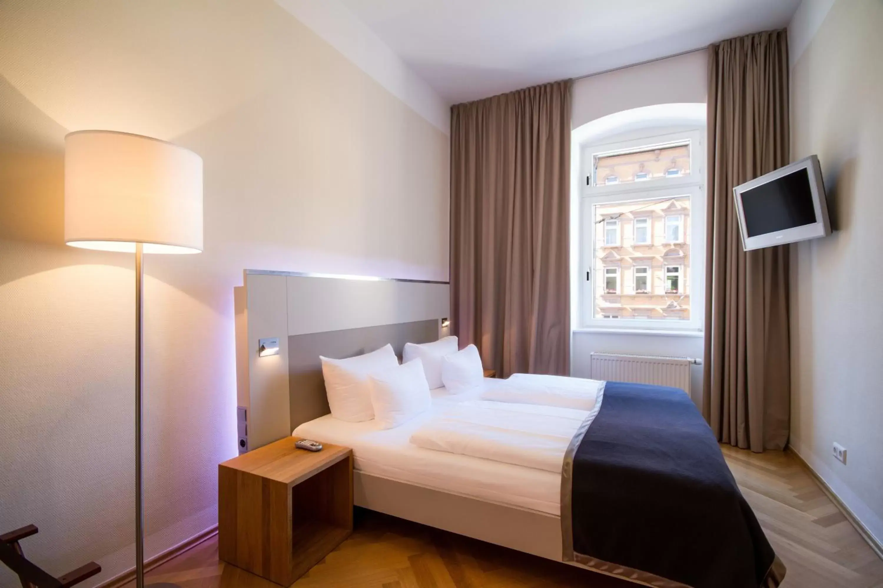 Bed in Qube Hotel Bergheim