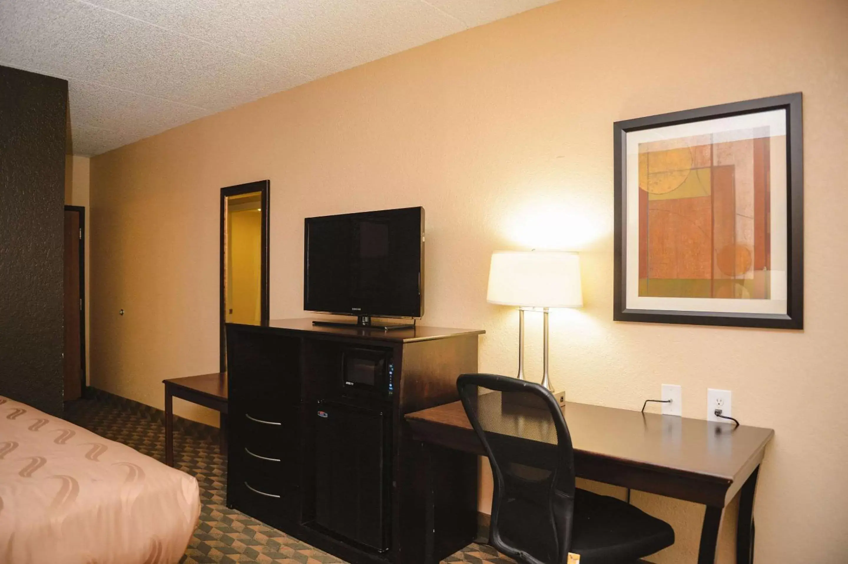 Photo of the whole room, TV/Entertainment Center in Quality Inn & Suites Ames Conference Center Near ISU Campus