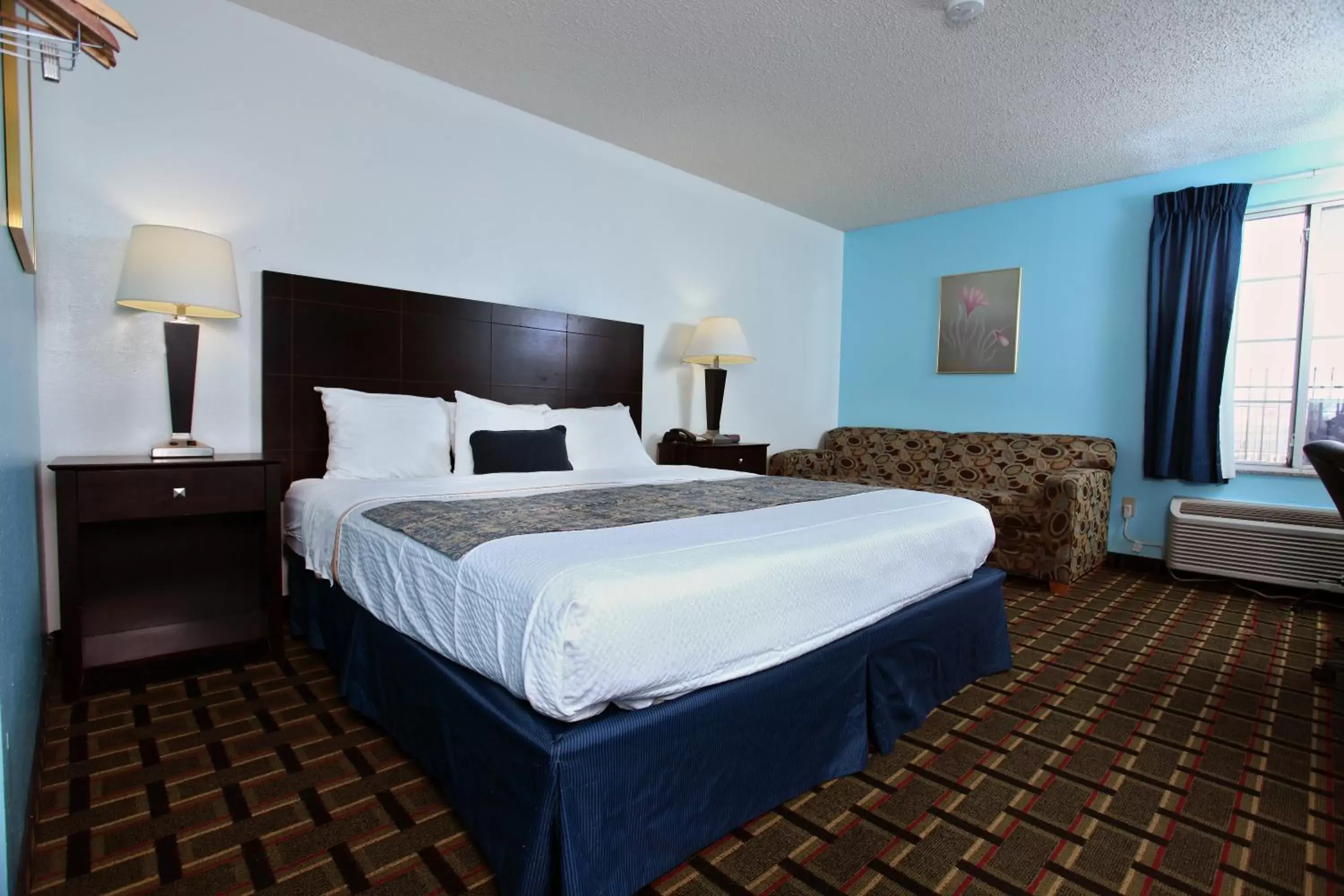 Bed in Coratel Inn & Suites by Jasper Newton