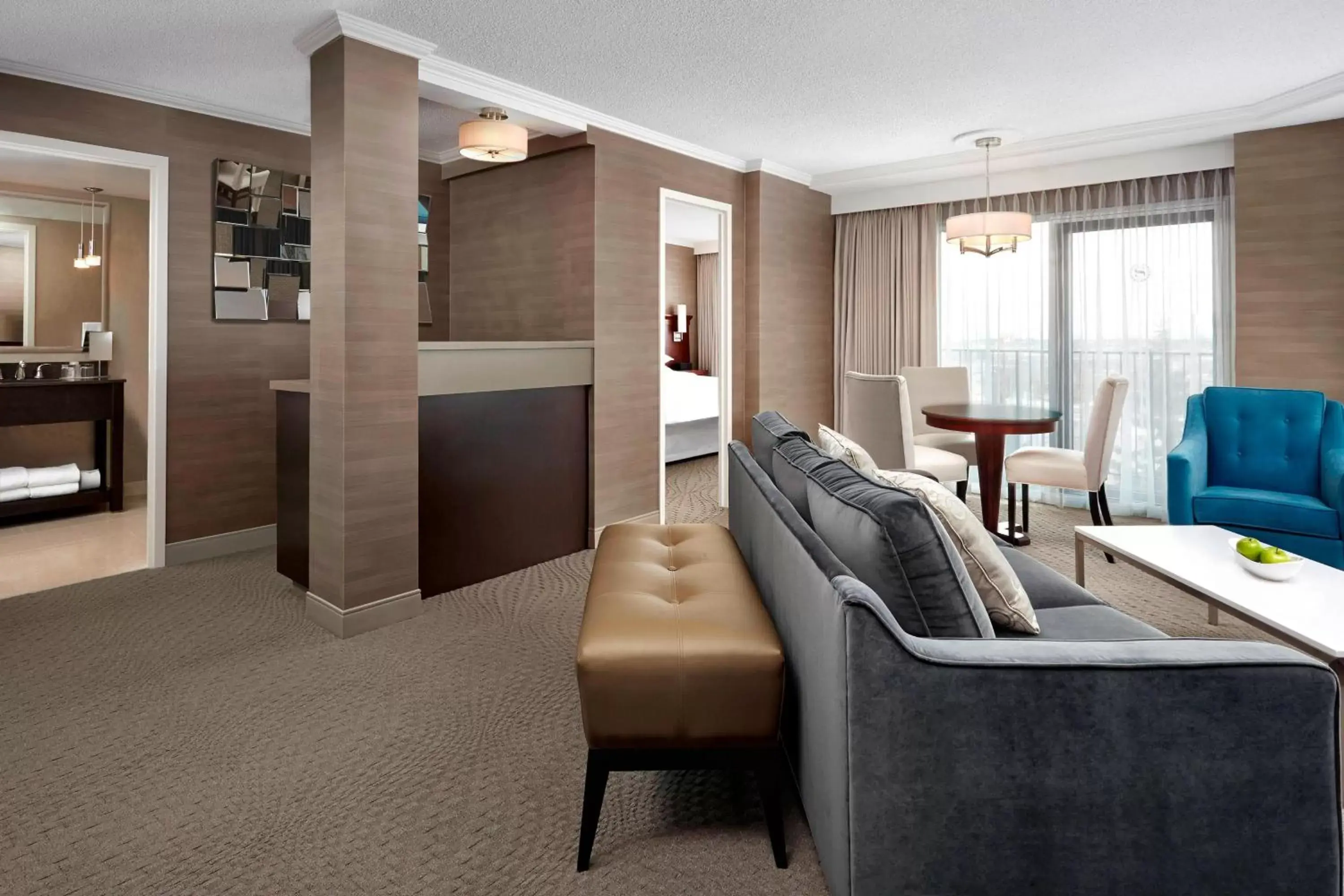 Bedroom, Seating Area in Sheraton Cavalier Calgary Hotel